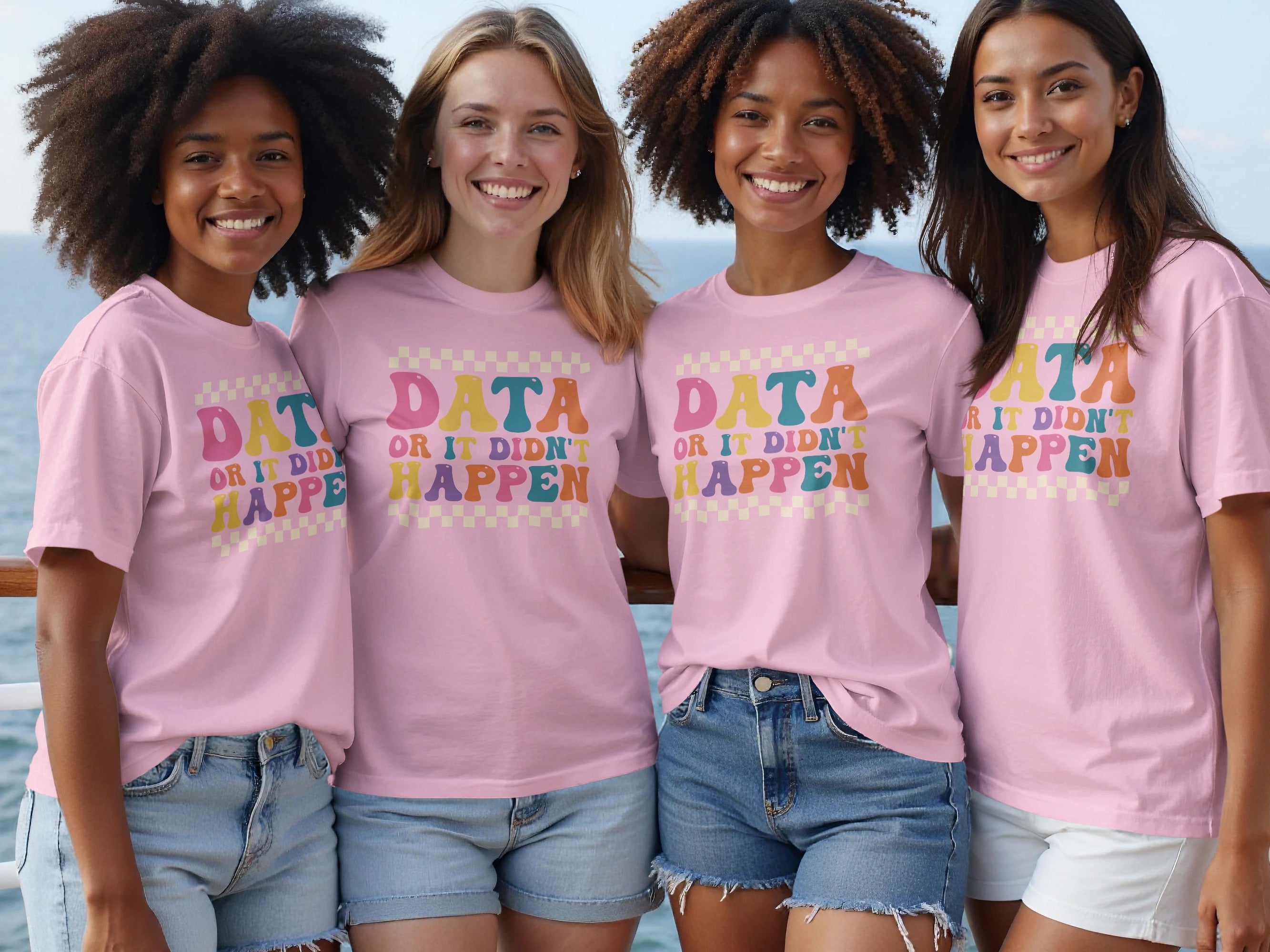 Four women wear pink t-shirts with "DATA OR IT DIDN'T HAPPEN" in colorful, retro font.