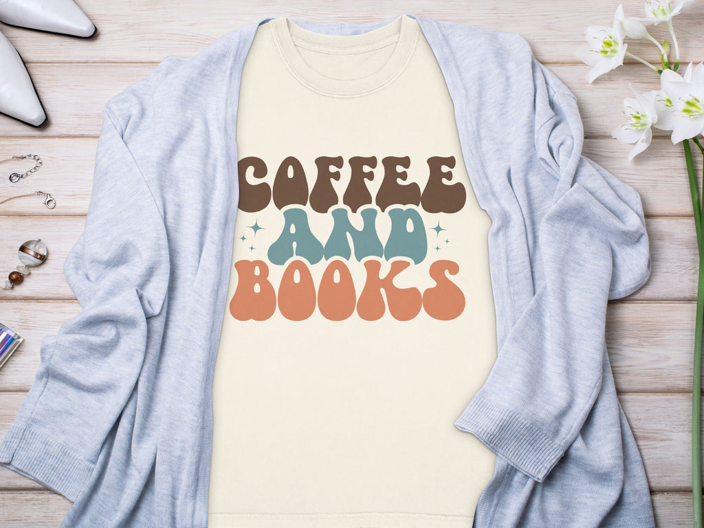 Cream t-shirt with brown, blue, and orange text reading "COFFEE AND BOOKS".