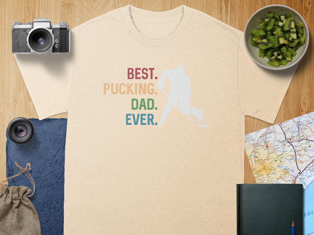 Cream t-shirt with "Best. Pucking. Dad. Ever." text and hockey player silhouette.