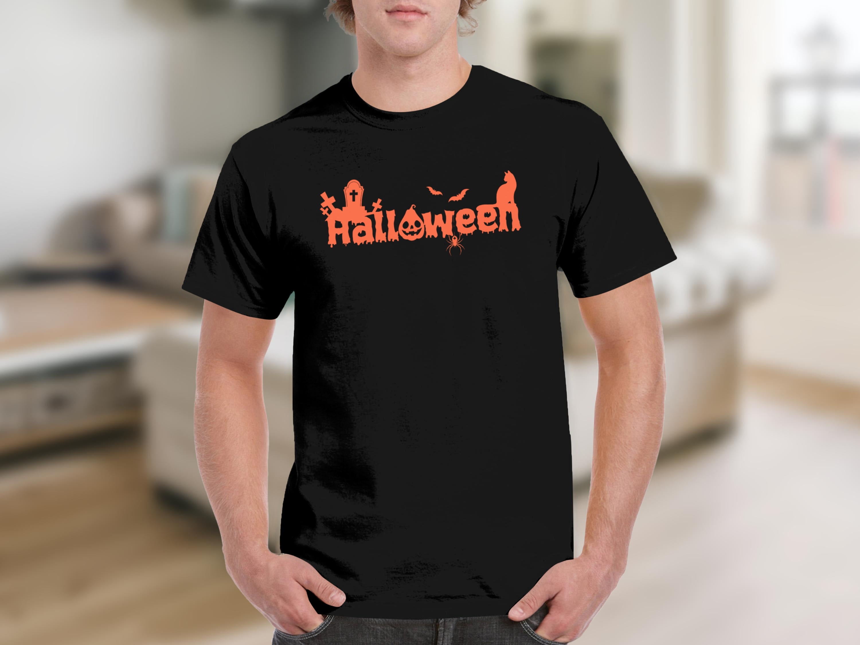 Black t-shirt with orange Halloween graphic featuring spooky elements and dripping text.