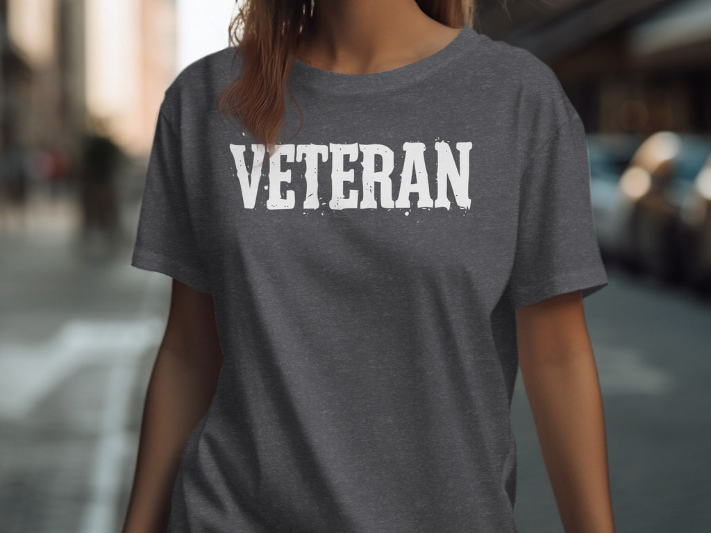 Dark grey t-shirt with "VETERAN" in distressed white lettering.