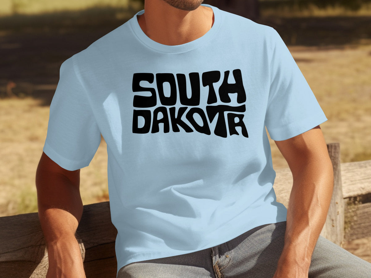 Light blue t-shirt with black "SOUTH DAKOTA" text.