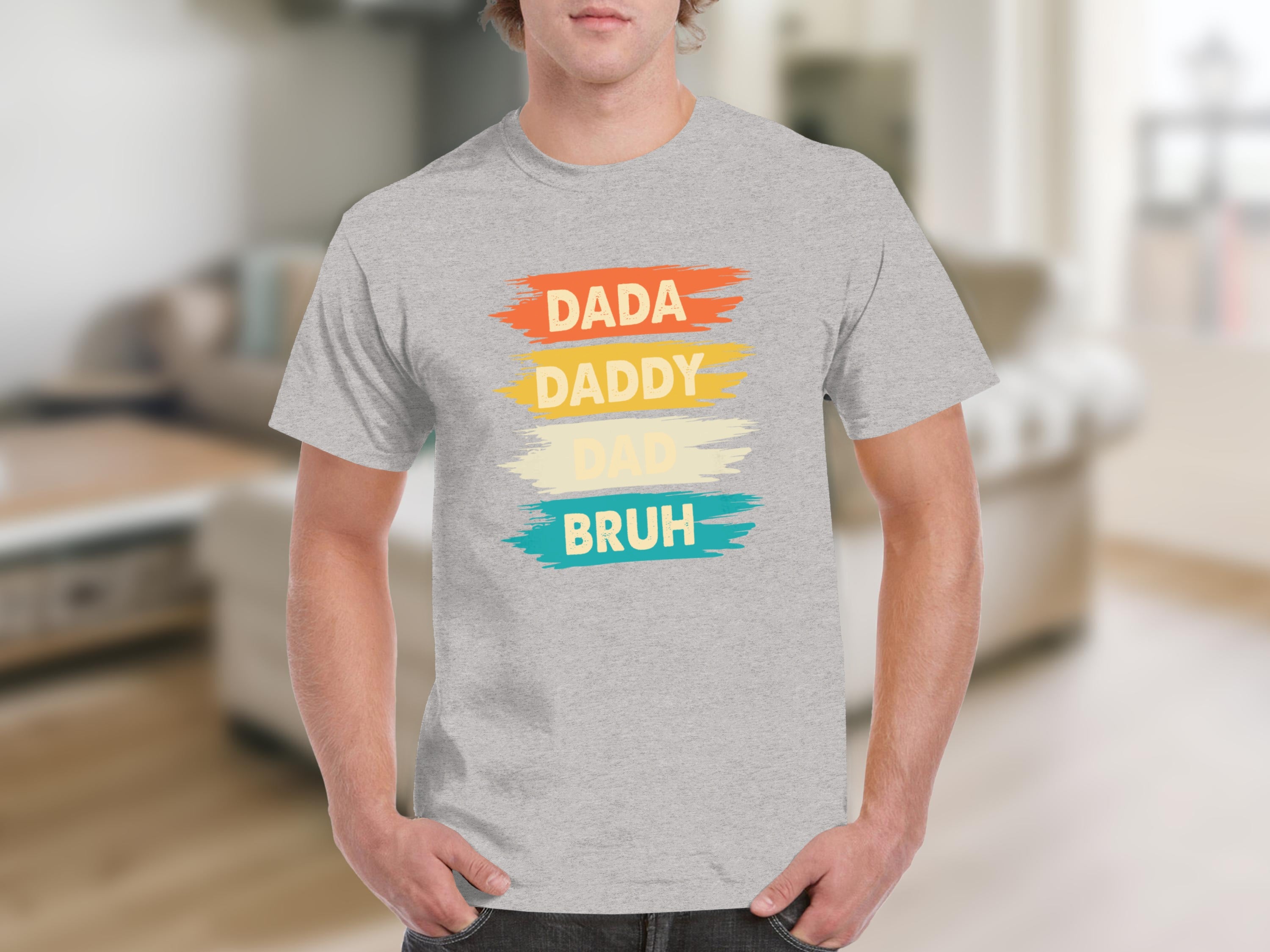 Grey t-shirt with "DADA DADDY DAD BRUH" text in colorful brush strokes.