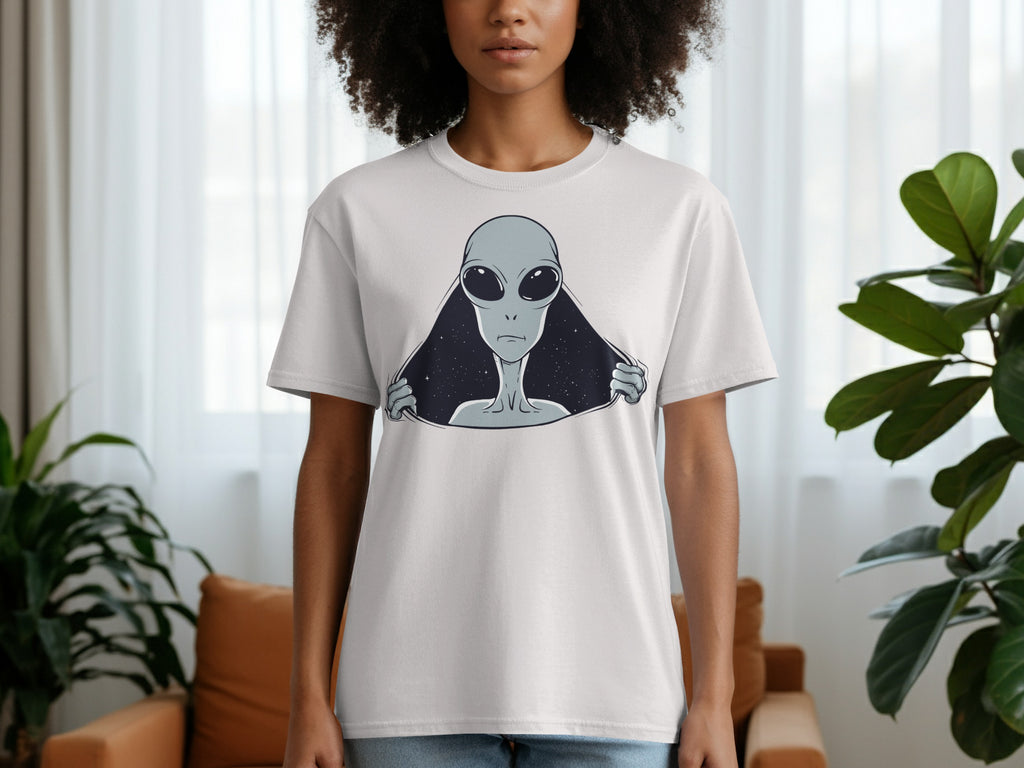 White t-shirt with a grey alien peeking out from a starry void graphic.