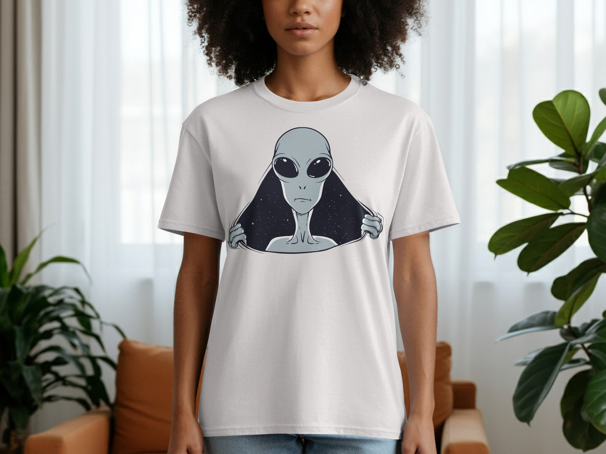 White t-shirt with a grey alien peeking out from a starry void graphic.