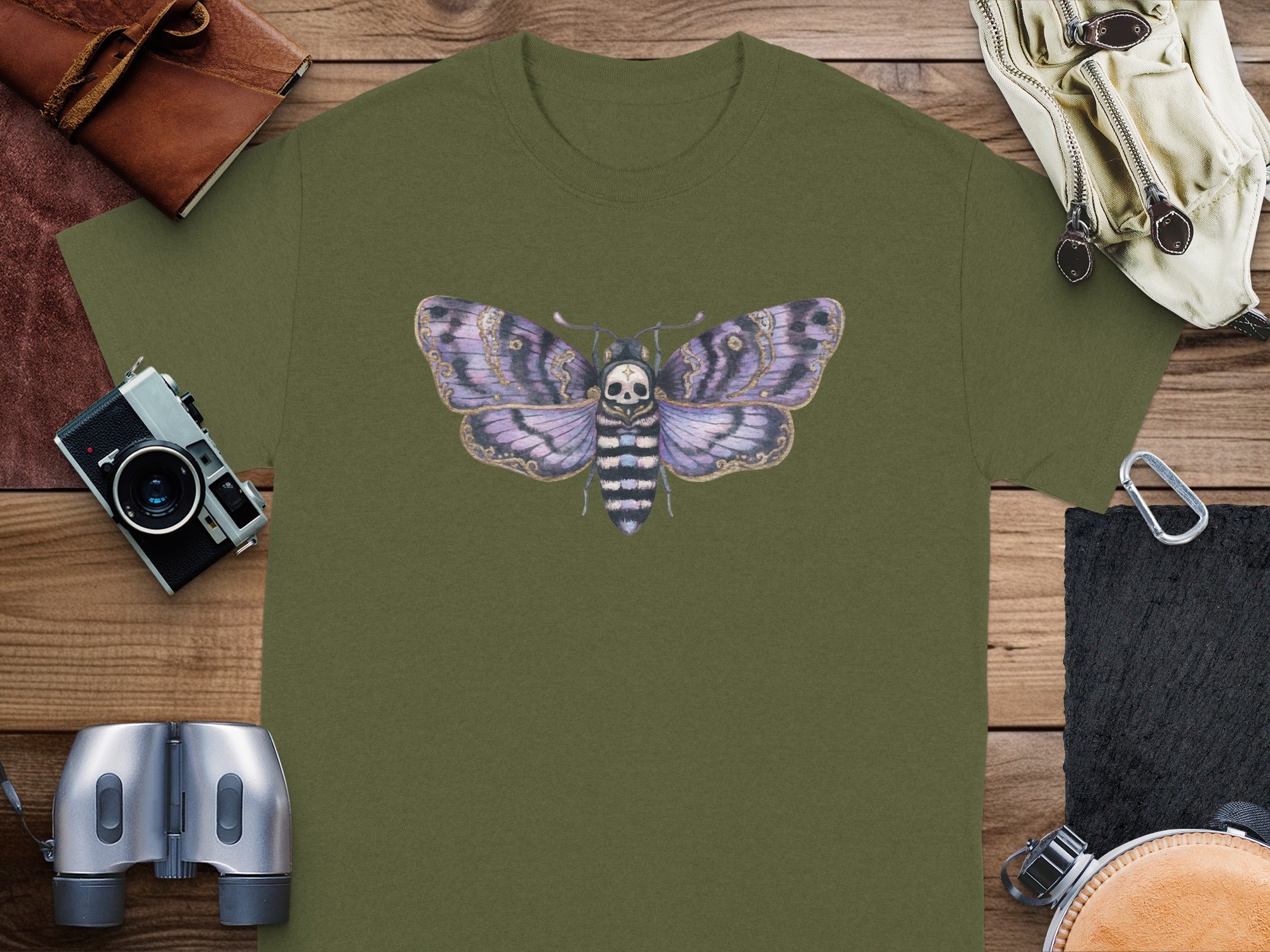 Green t-shirt with a death's-head hawkmoth graphic centered on chest.
