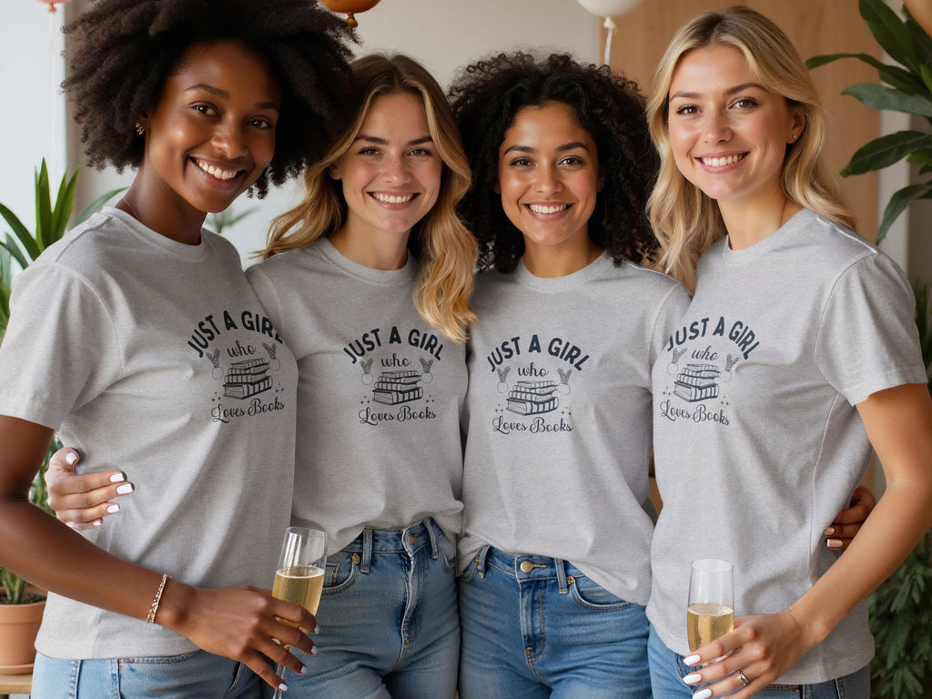 Four women in grey shirts with "JUST A GIRL who Loves Books" printed on them.
