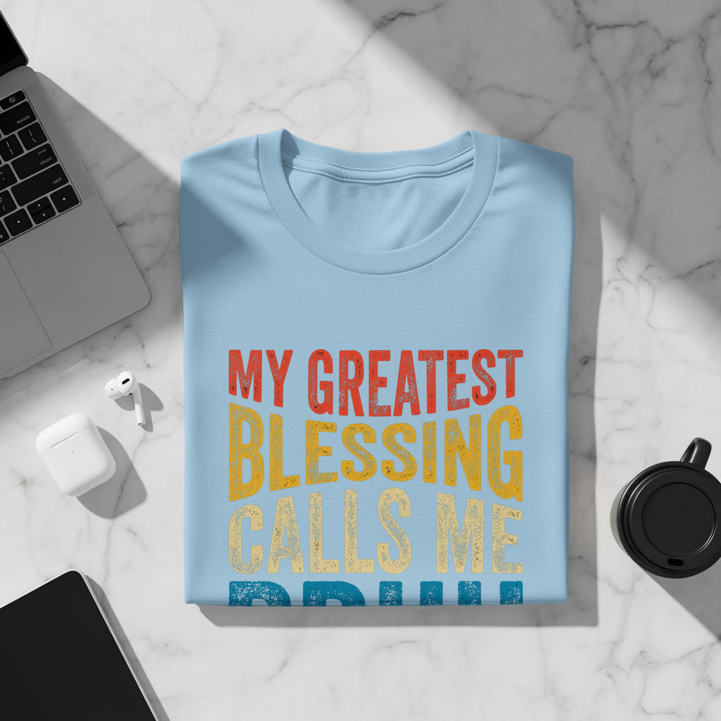 Light blue t-shirt with text "My Greatest Blessing Calls Me Grandma".