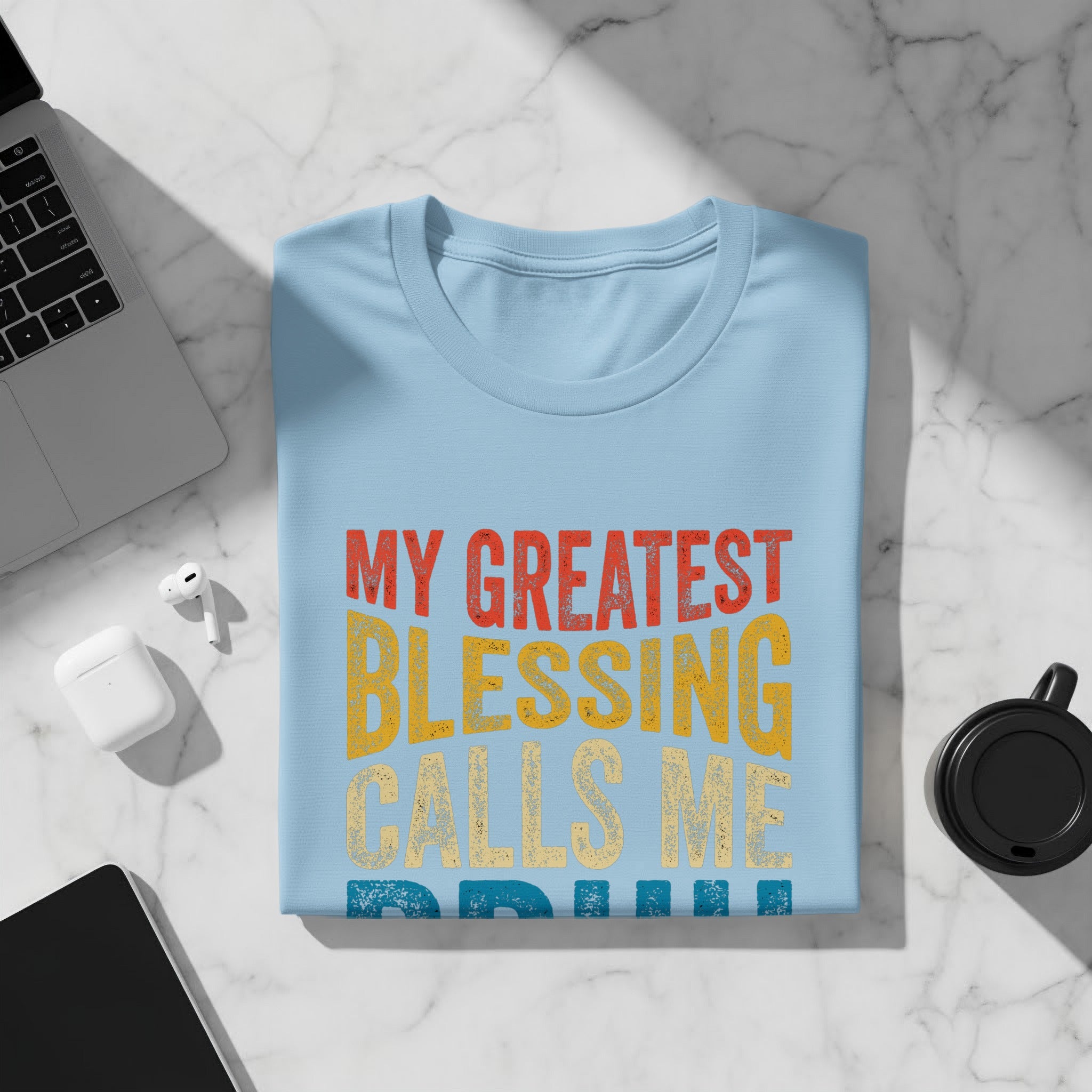 Light blue t-shirt with text "My Greatest Blessing Calls Me Grandma".
