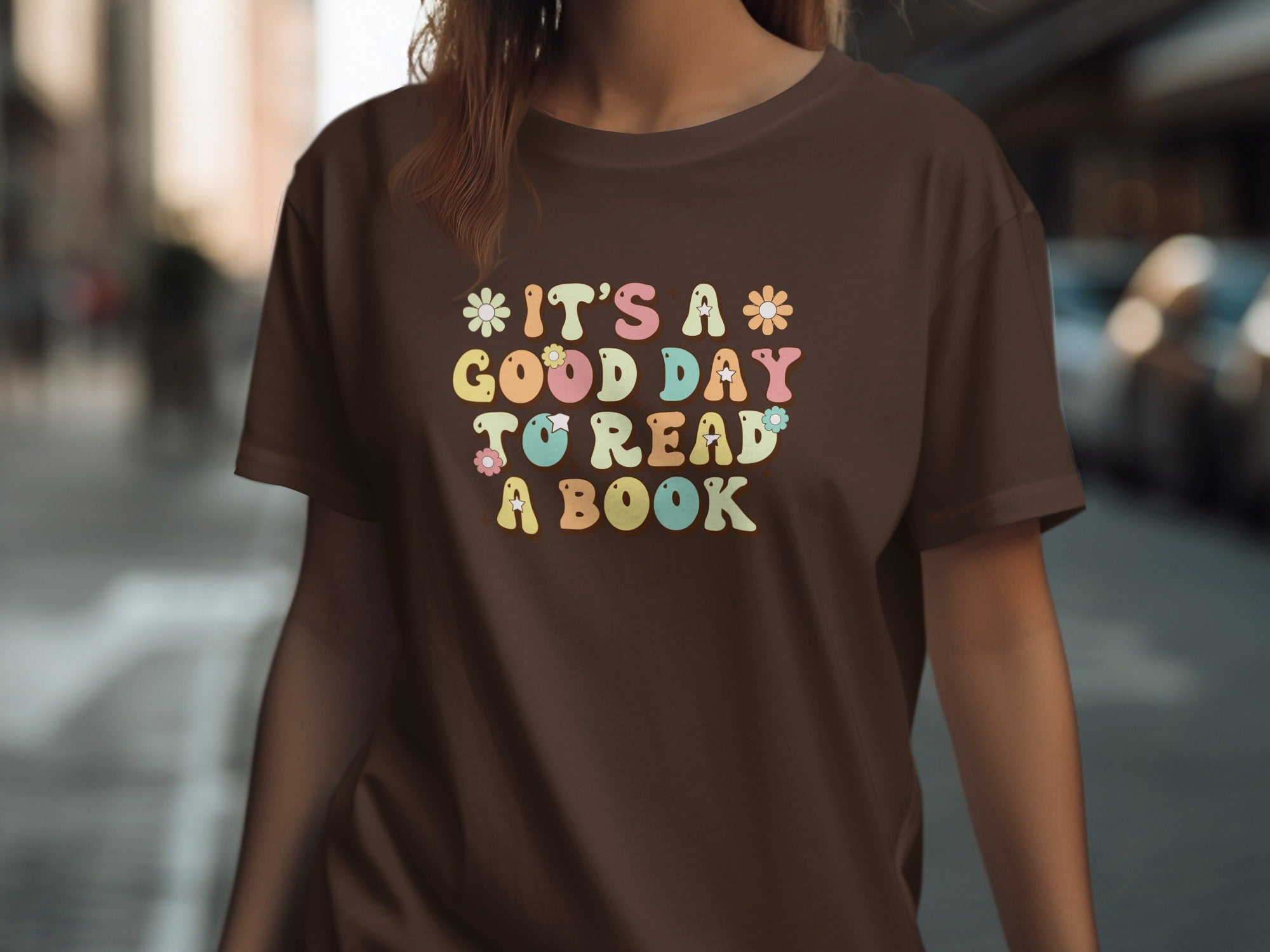 Brown t-shirt with "It's a Good Day To Read A Book" text and floral accents.