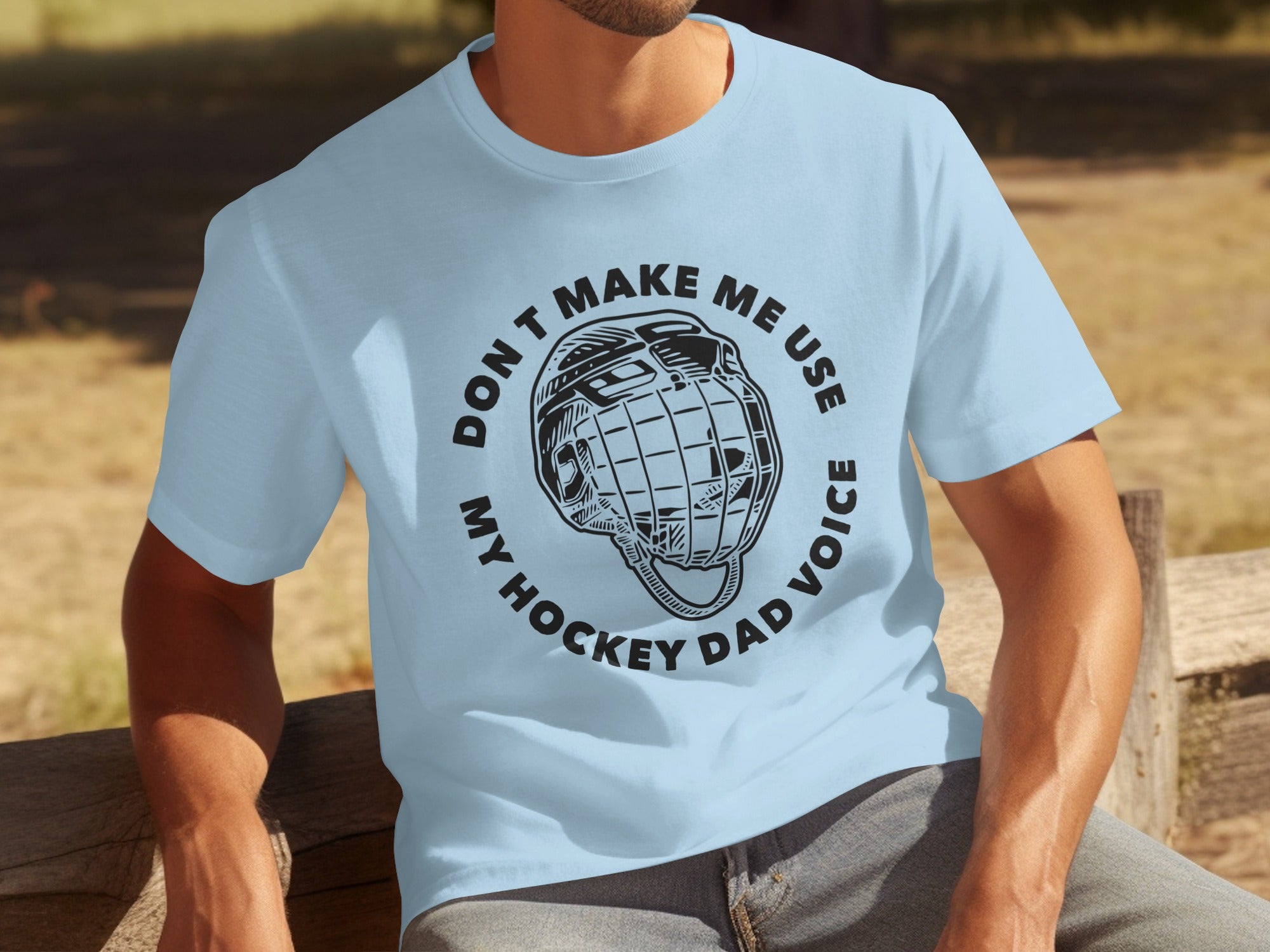 Light blue t-shirt with "DON'T MAKE ME USE MY HOCKEY DAD VOICE" and a helmet.
