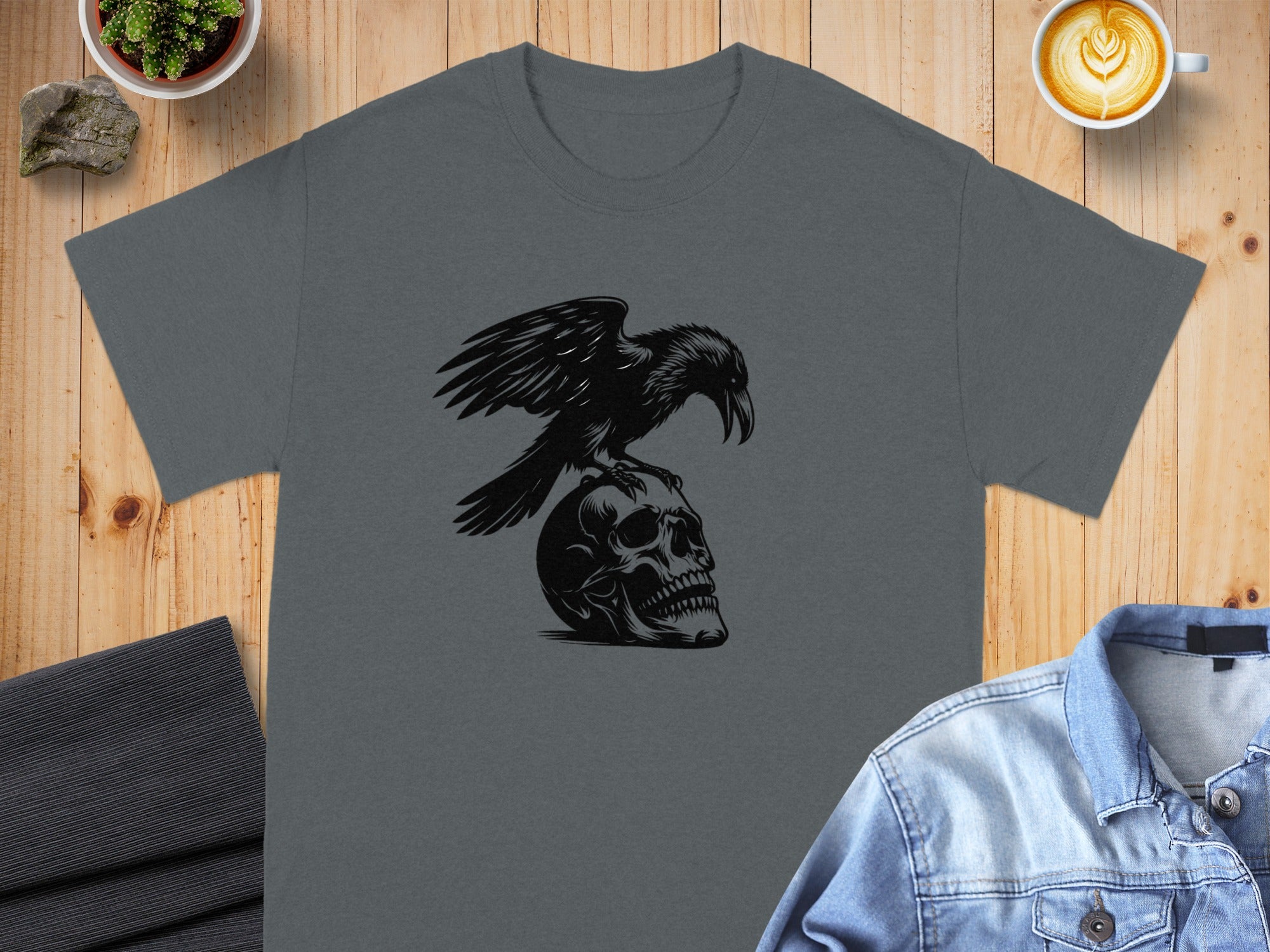 Dark grey t-shirt with a black raven perched on a skull graphic.