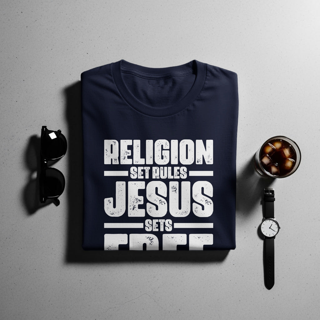 Navy t-shirt with "RELIGION SET RULES JESUS SETS FREE" graphic