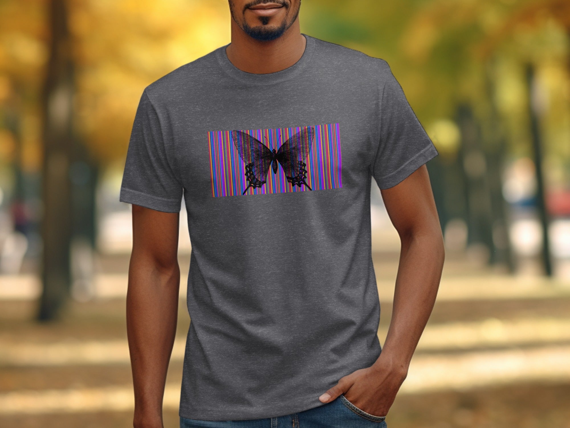Dark grey t-shirt with a black butterfly on a colorful striped background.