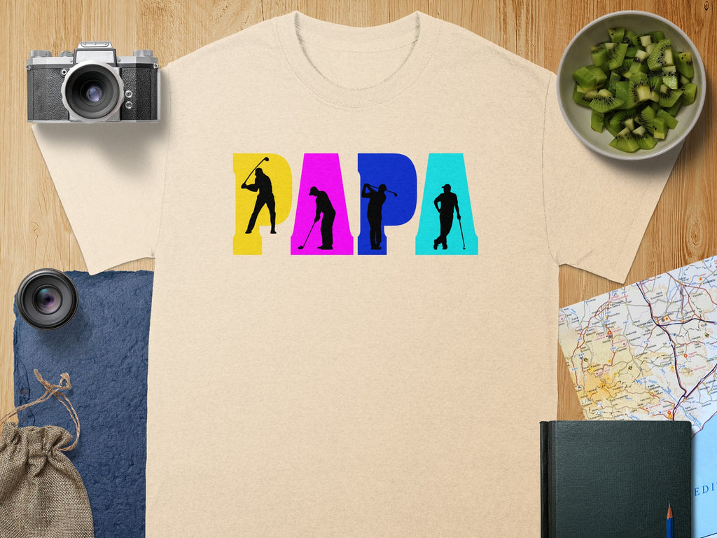 Cream t-shirt with the word PAPA in large colorful letters and golf player silhouettes.