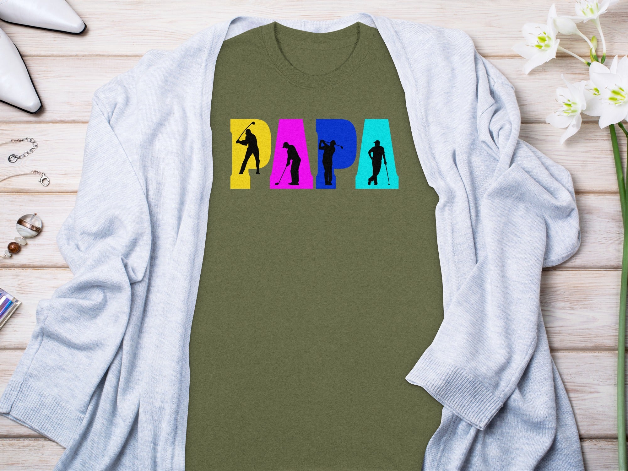Olive green t-shirt with "PAPA" text featuring golfer silhouettes.