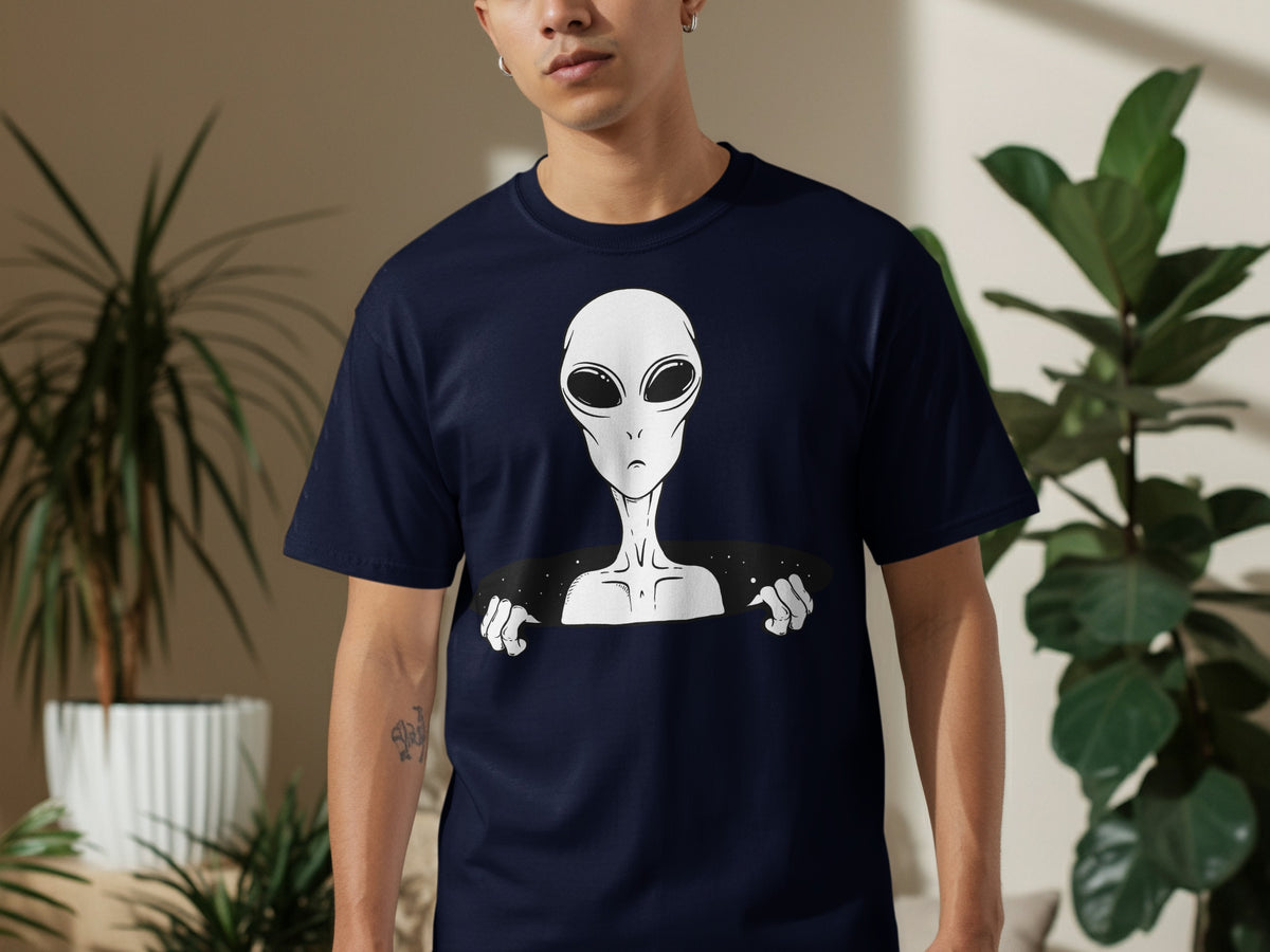 Navy t-shirt with a white alien graphic emerging from a black space void.
