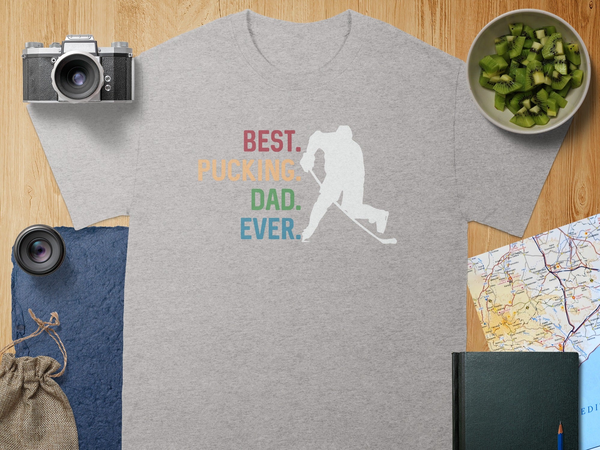 Grey t-shirt with white hockey player silhouette and text "BEST. PUCKING DAD. EVER."