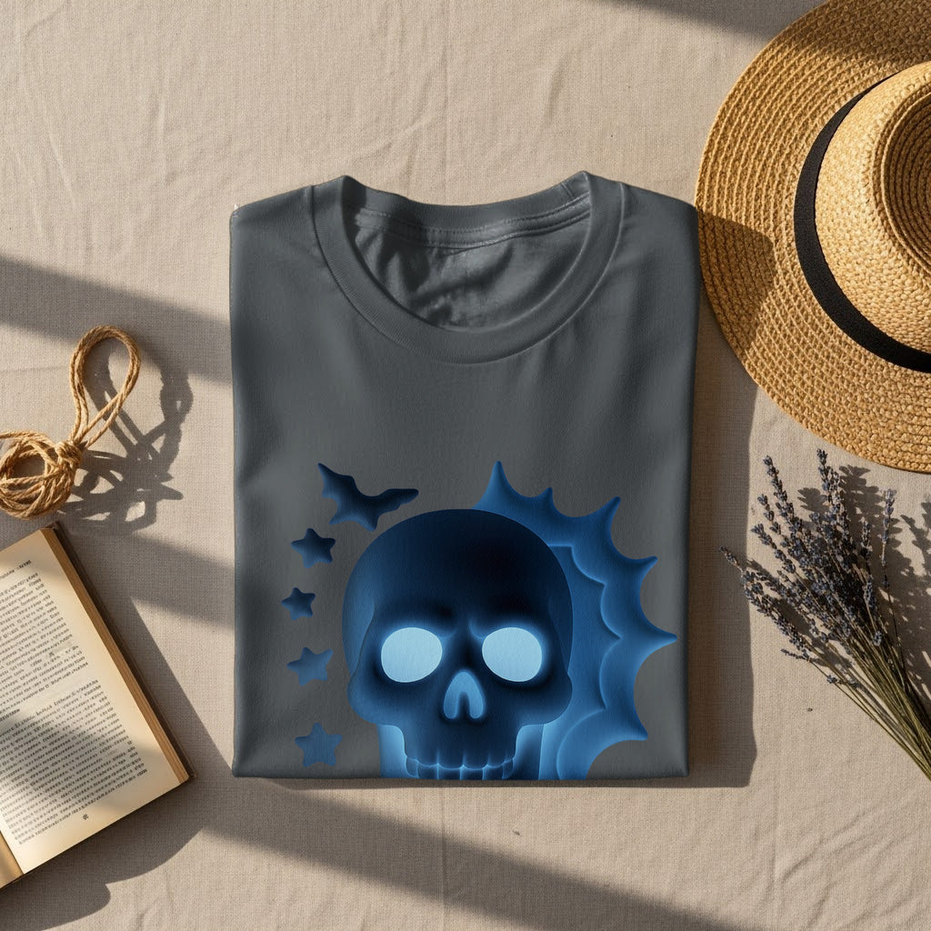 Dark grey t-shirt with glowing blue skull and bat graphic, surrounded by decorative items.