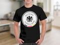 Black t-shirt with the German Football Association logo on the chest.