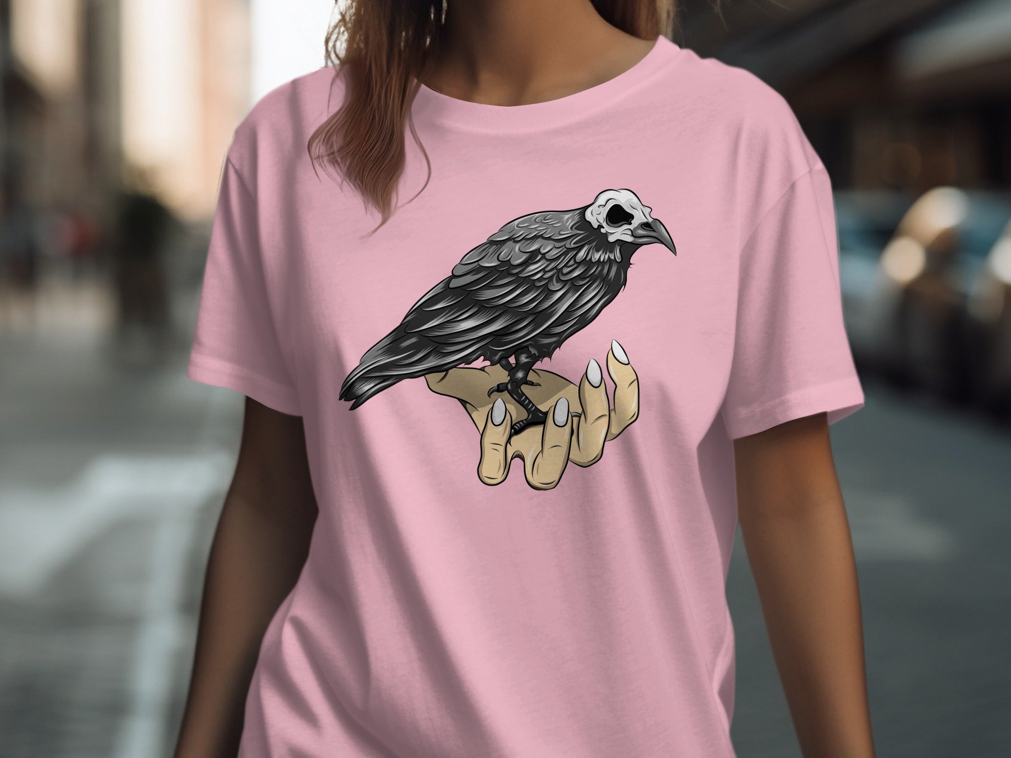 Raven with skull-like head perched on a woman's hand.