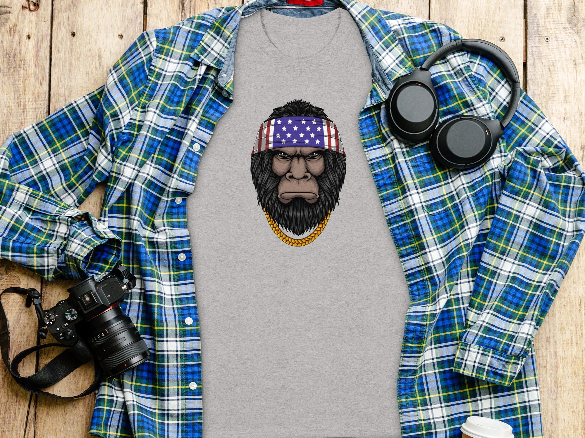 T-shirt with ape graphic wearing American flag bandana and gold chain.
