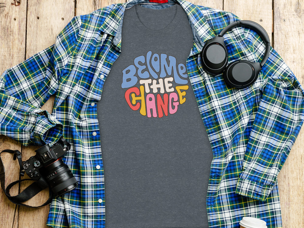 Gray t-shirt with "Become the Change" in colorful retro lettering.