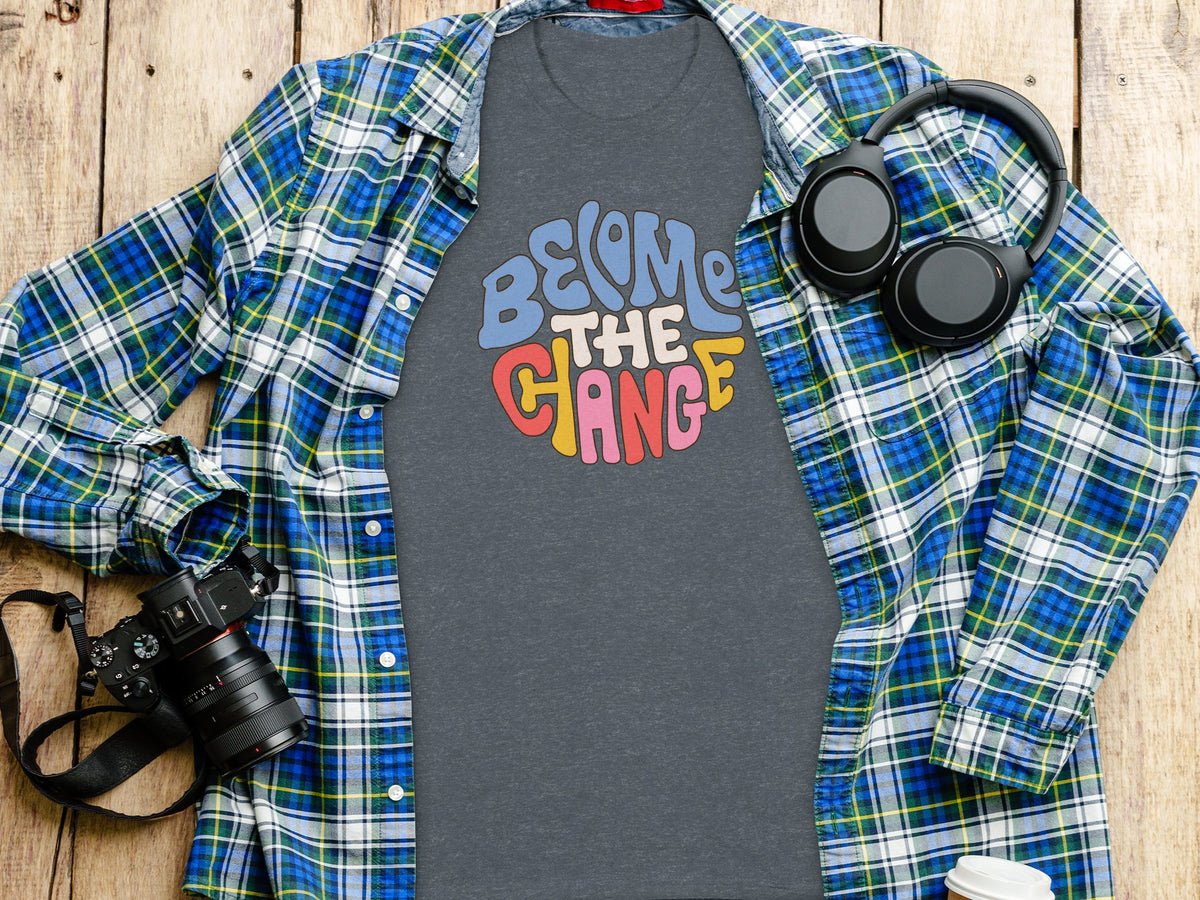 Gray t-shirt with "Become the Change" in colorful retro lettering.