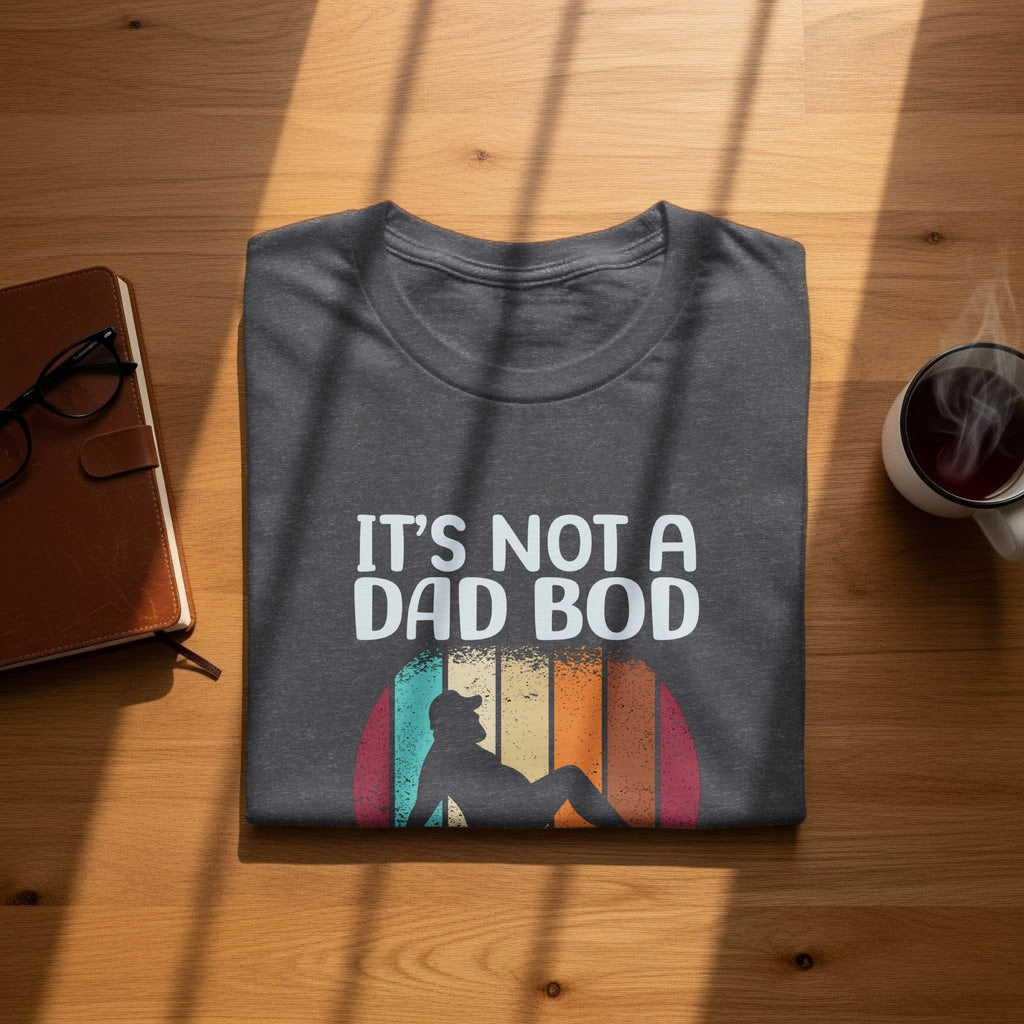 Dark grey t-shirt with "IT'S NOT A DAD BOD" and retro graphic.