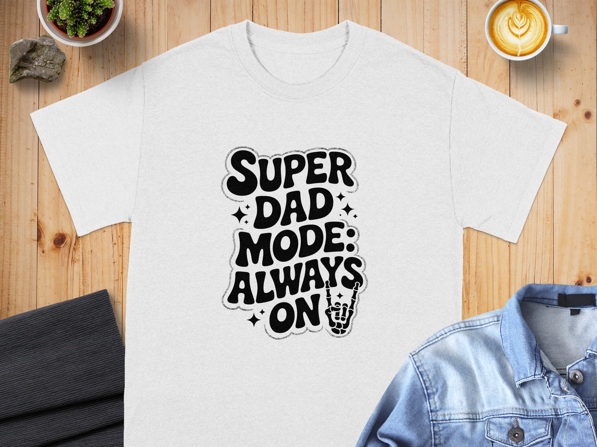 White t-shirt with "SUPER DAD MODE: ALWAYS ON" graphic and skeleton hand.