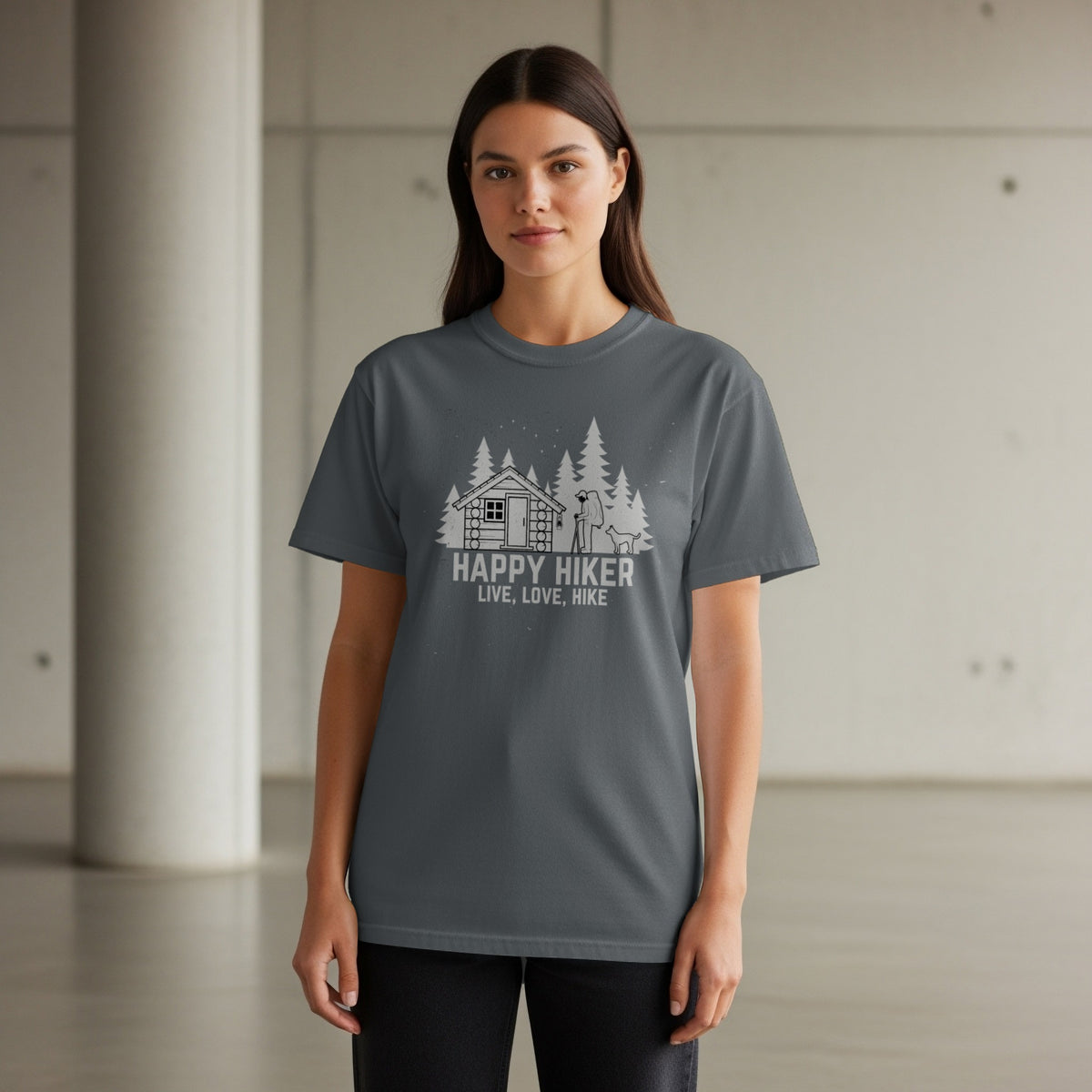 Grey t-shirt with white graphic of a cabin, hiker, dog, and trees, reads "Happy Hiker".