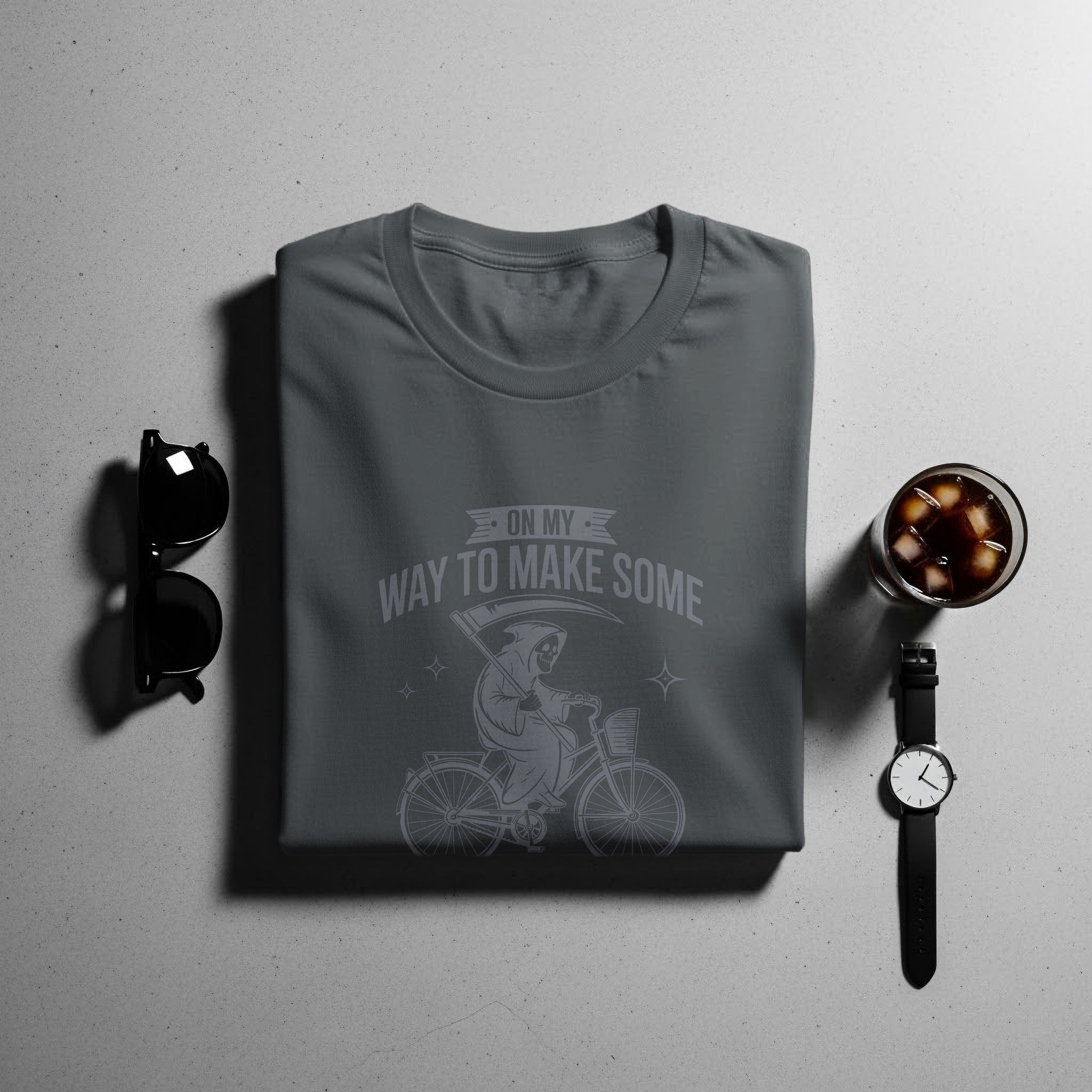 Gray t-shirt with grim reaper on bicycle graphic and text "On My Way To Make Some".