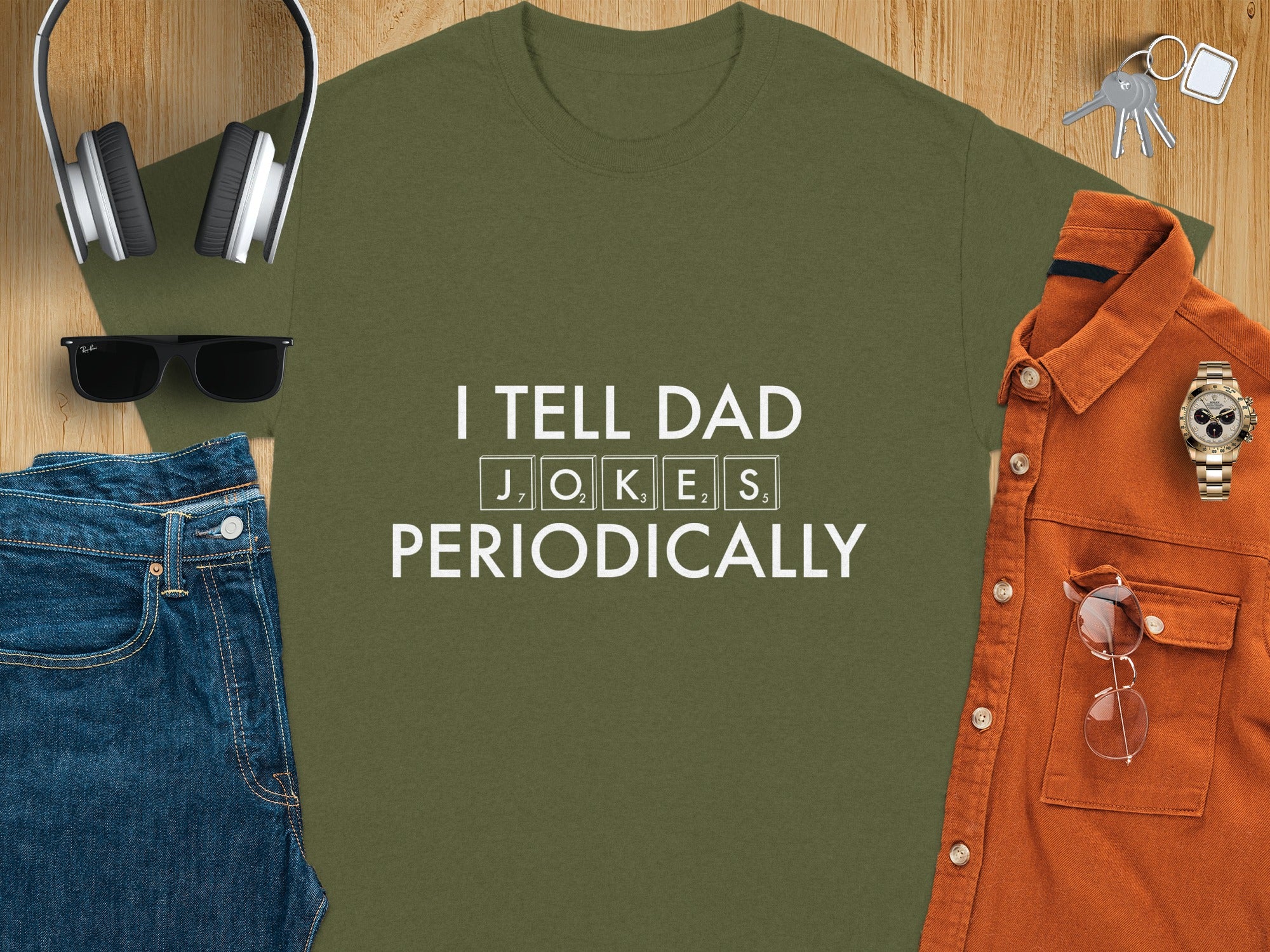 Olive green t-shirt with text "I TELL DAD JOKES PERIODICALLY".