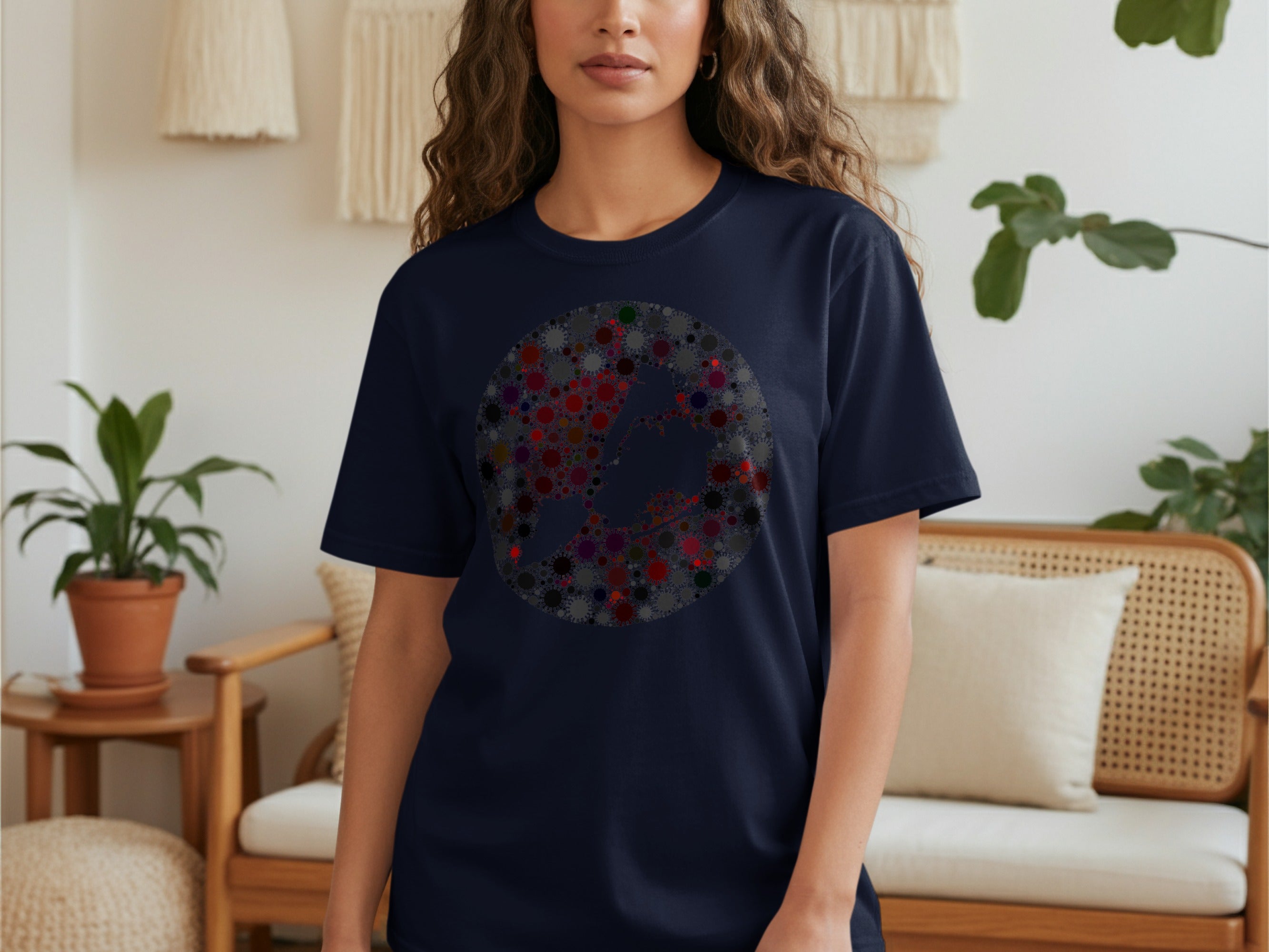 Dark navy t-shirt with a circular abstract pattern of colorful virus-like shapes.