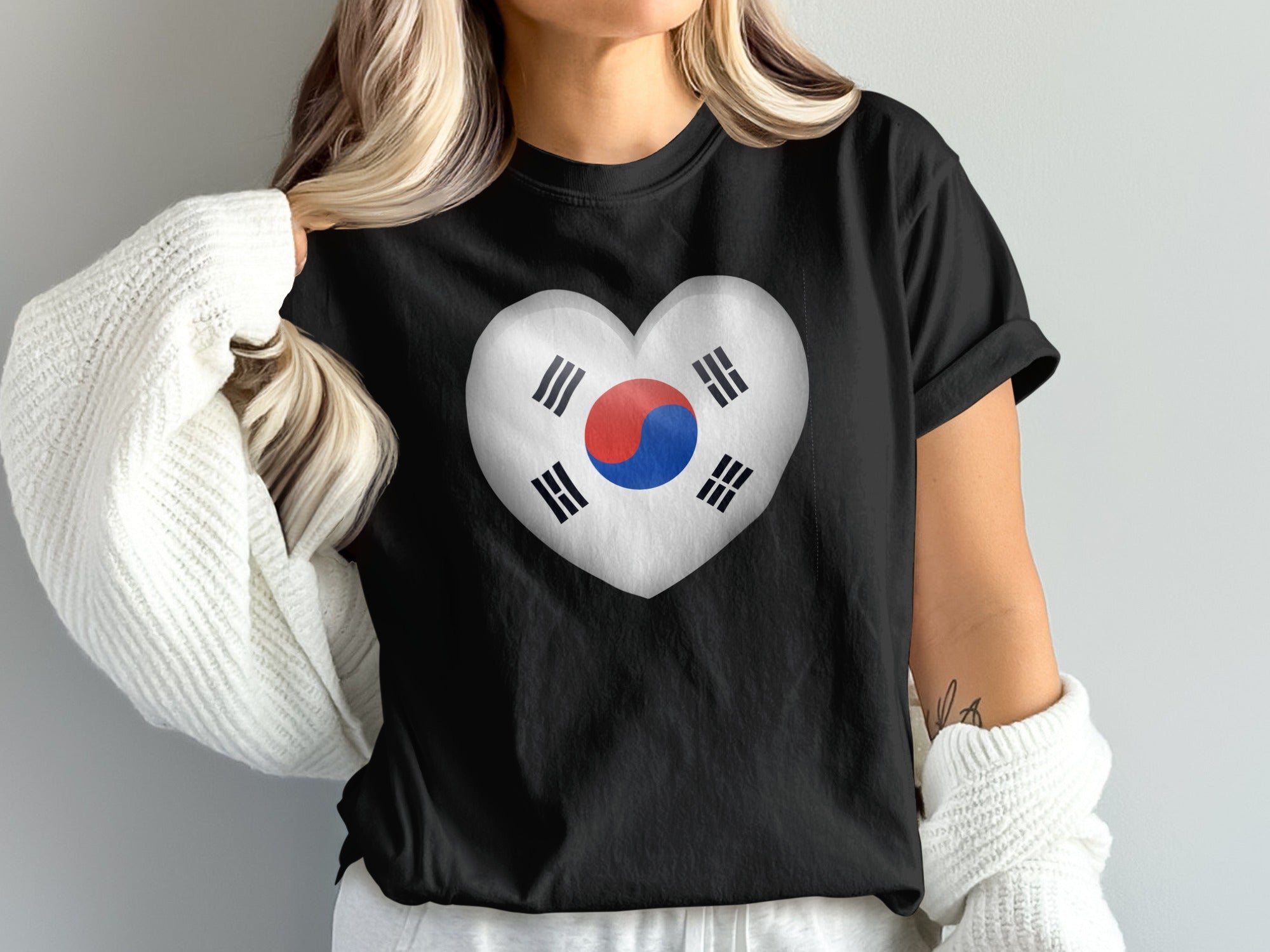 Black t-shirt with a white heart showing the South Korean flag.