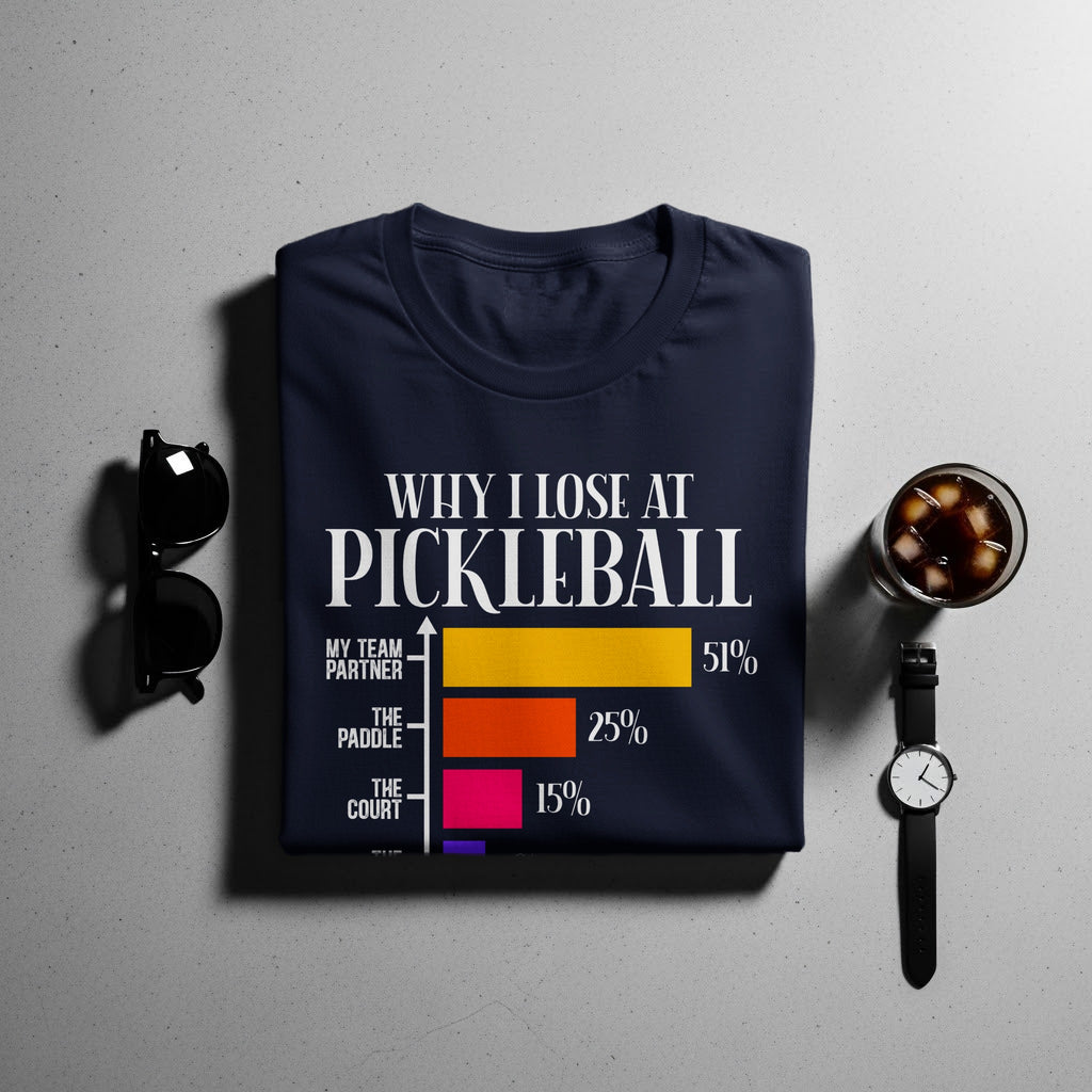 Navy t-shirt with "Why I Lose at Pickleball" graphic showing statistics.