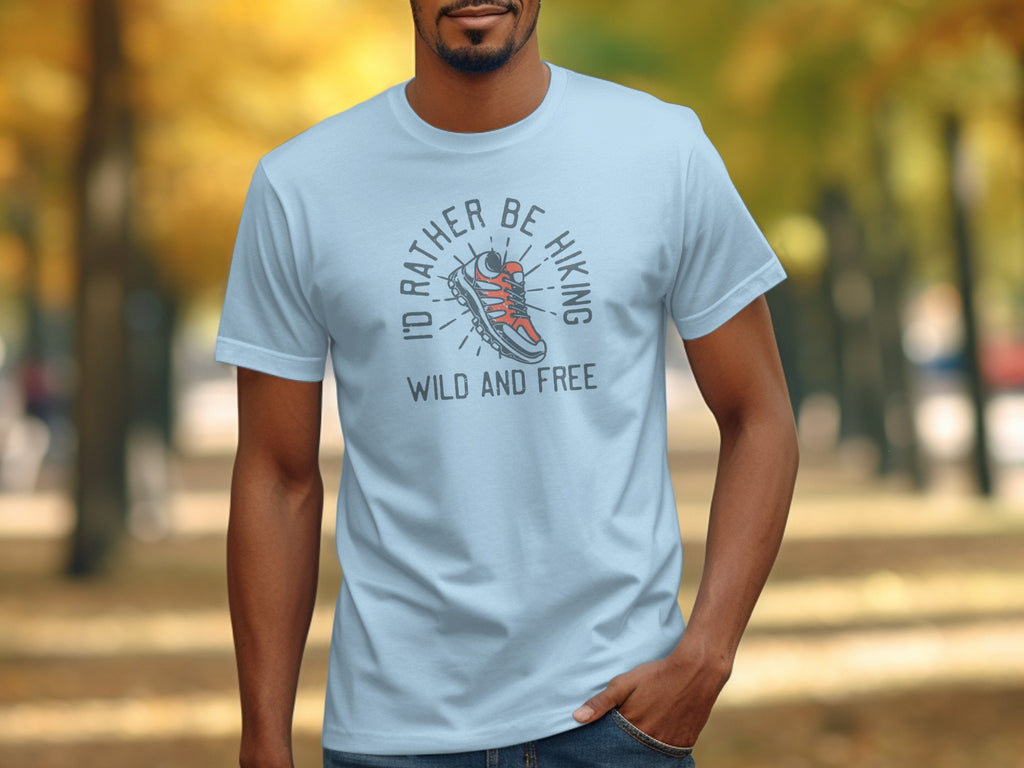 Light blue t-shirt with "I'd Rather Be Hiking Wild and Free" graphic.