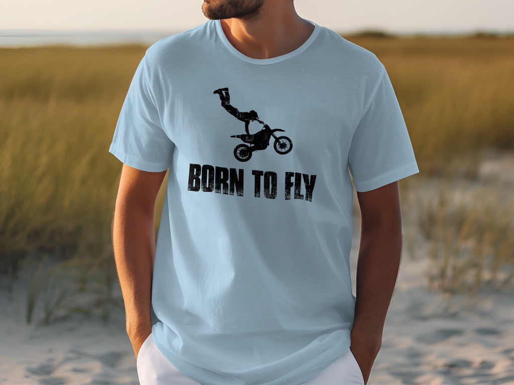 Light blue t-shirt with black graphic of motocross rider and "BORN TO FLY" text.