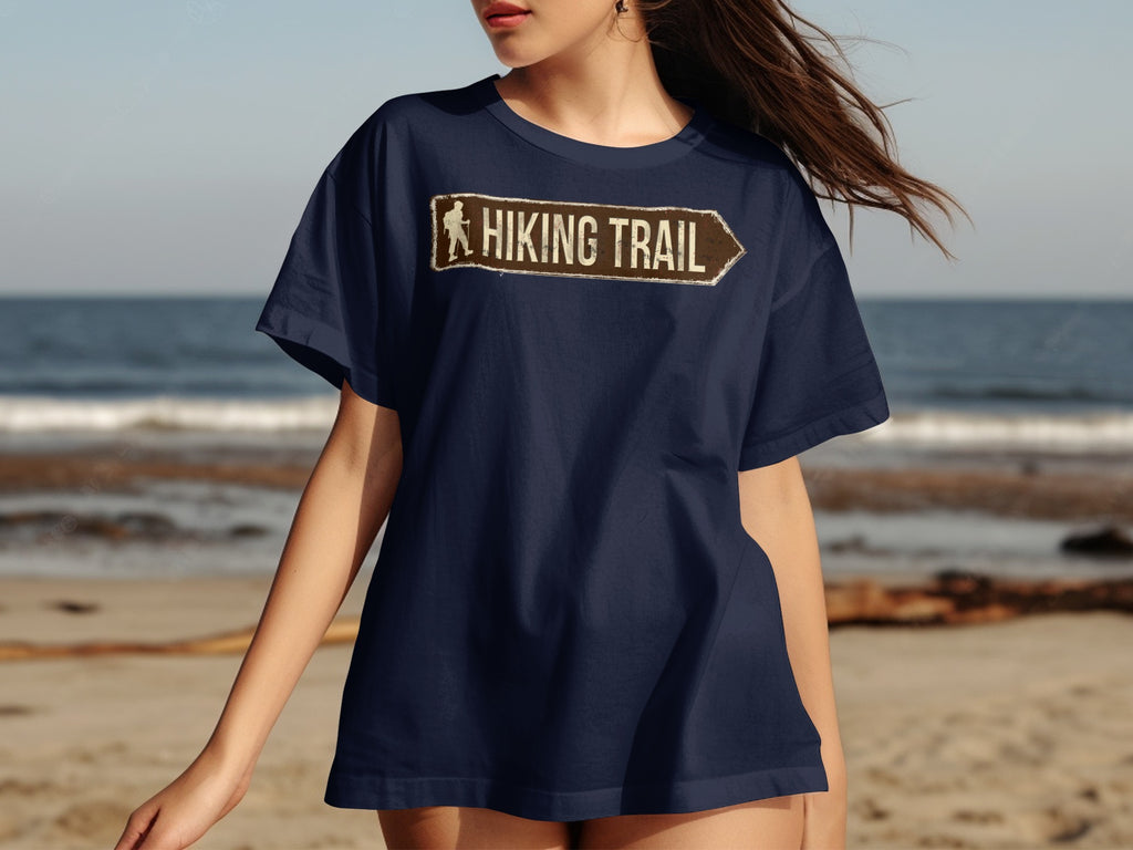 Dark blue t-shirt with distressed "Hiking Trail" sign graphic and hiker silhouette.