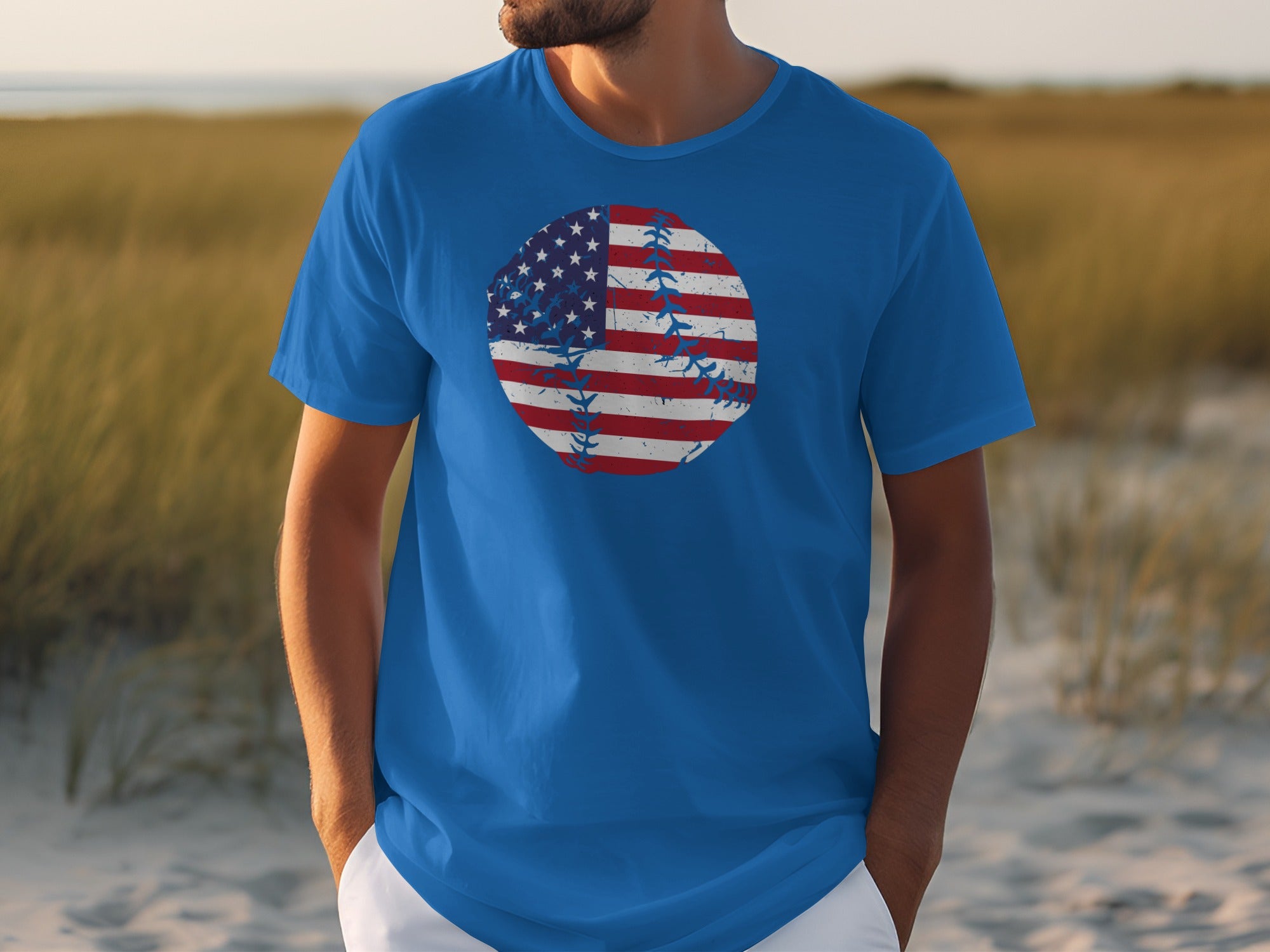 Blue t-shirt with distressed American flag baseball graphic on chest.