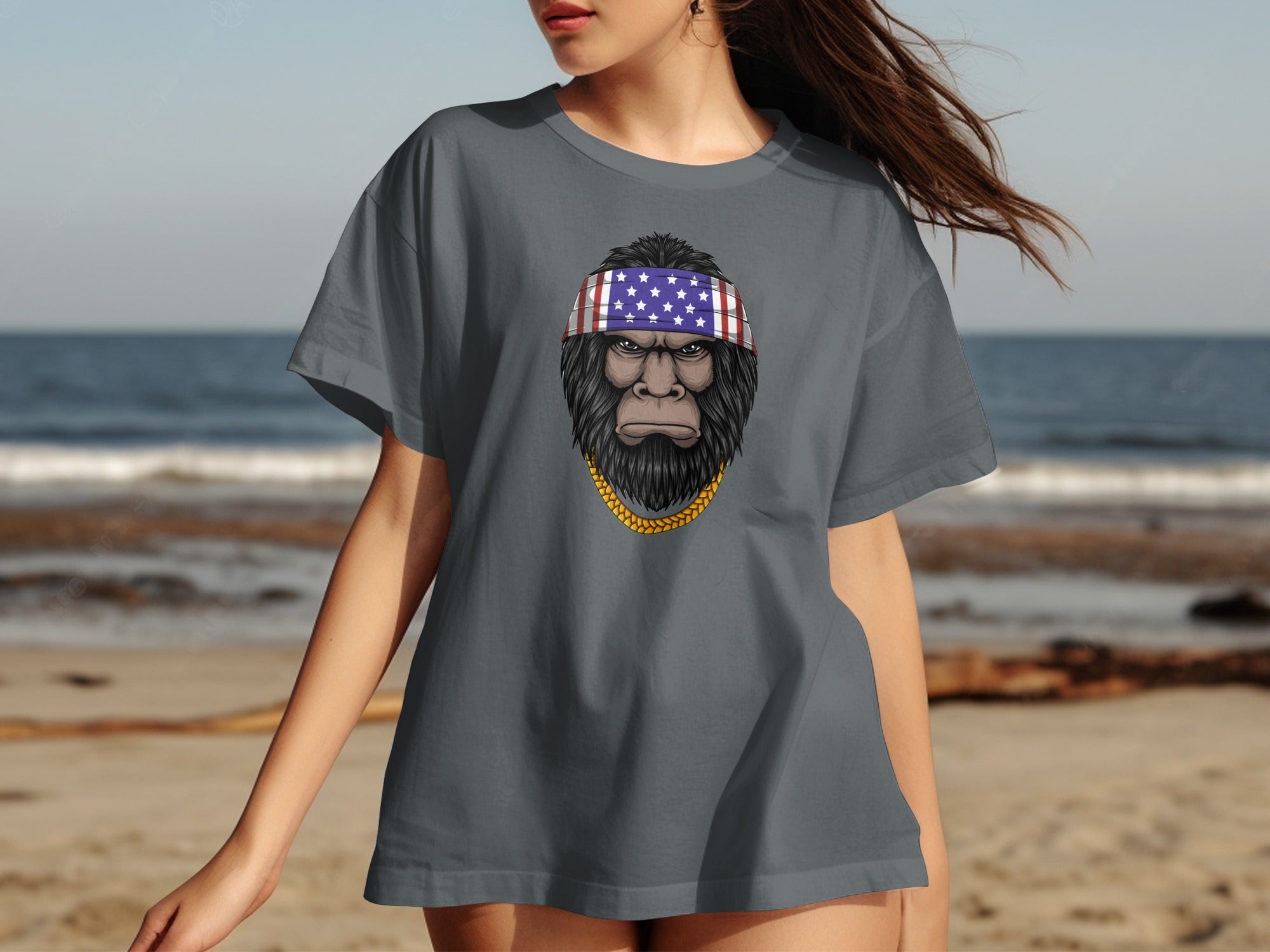 T-shirt with Bigfoot graphic wearing American flag bandana and gold chain