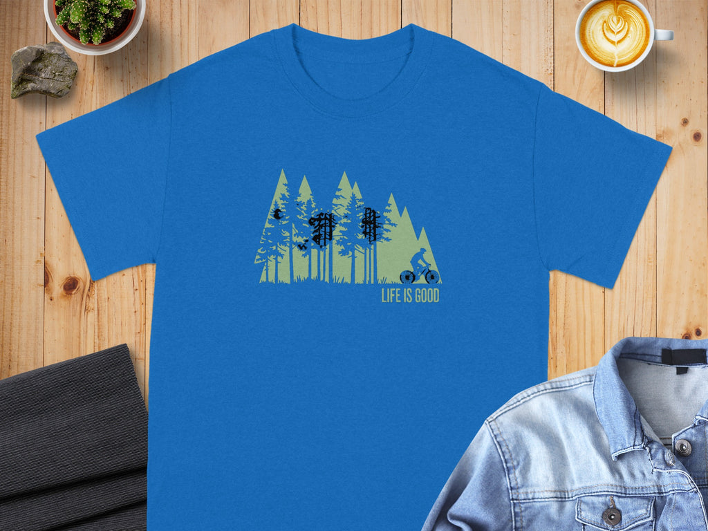 Blue t-shirt with a graphic of trees, a cyclist, and the text "LIFE IS GOOD".