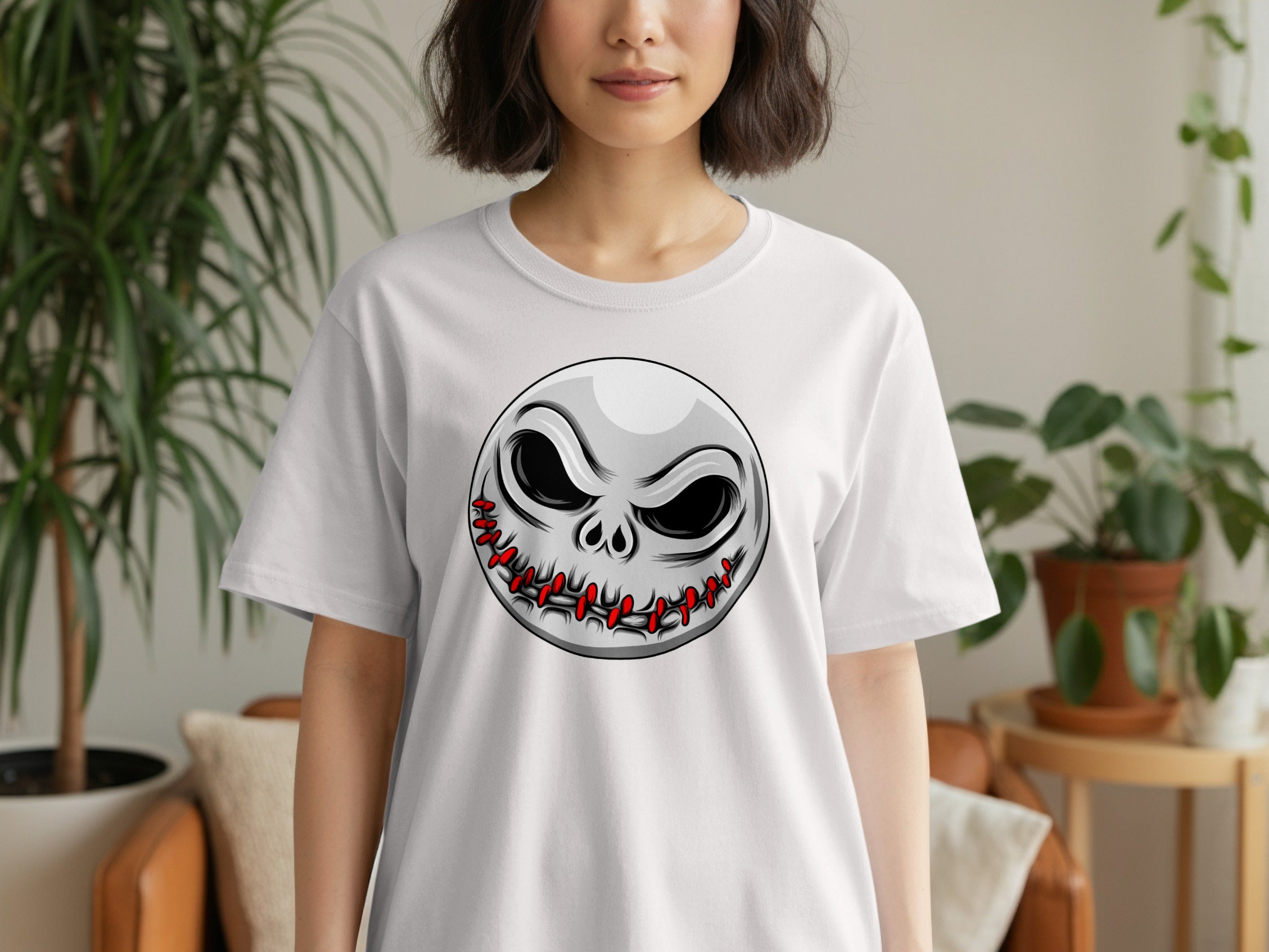 White t-shirt with a circular, stitched-mouth Jack Skellington graphic.