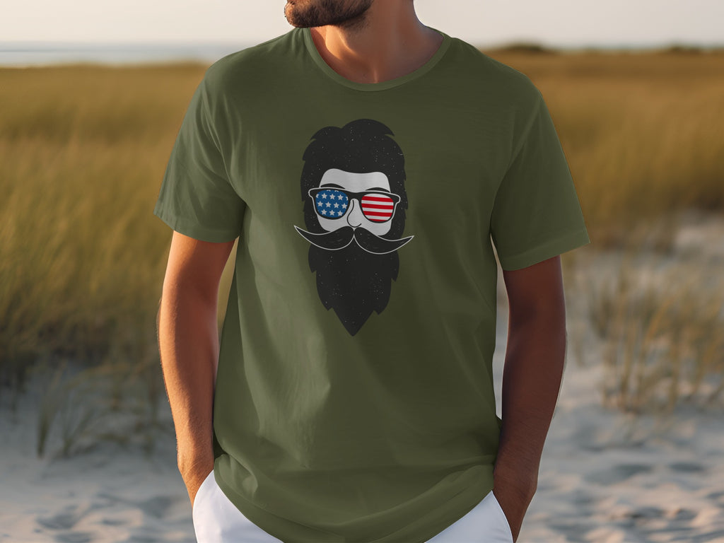 Green t-shirt with a man wearing American flag sunglasses and a beard graphic.
