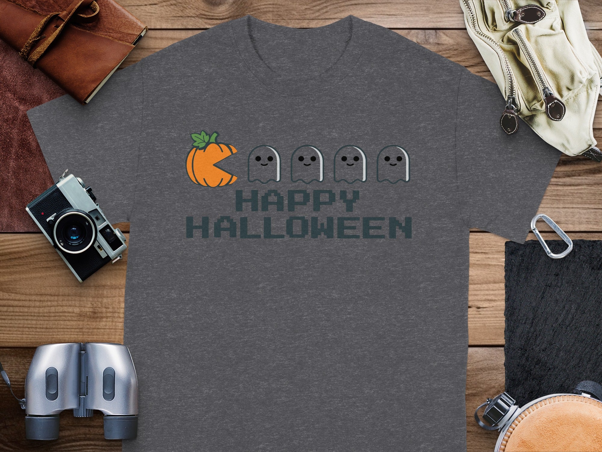 Gray t-shirt with pixelated pumpkin and ghosts saying "Happy Halloween."