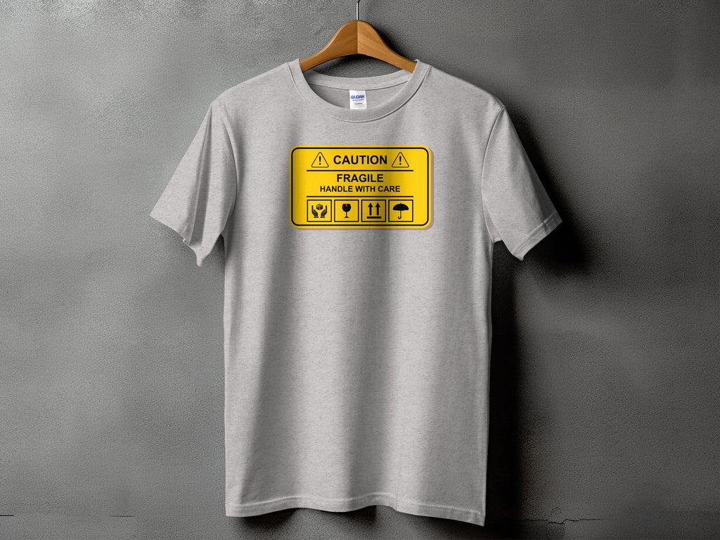 Gray t-shirt with "CAUTION FRAGILE HANDLE WITH CARE" and shipping symbols.