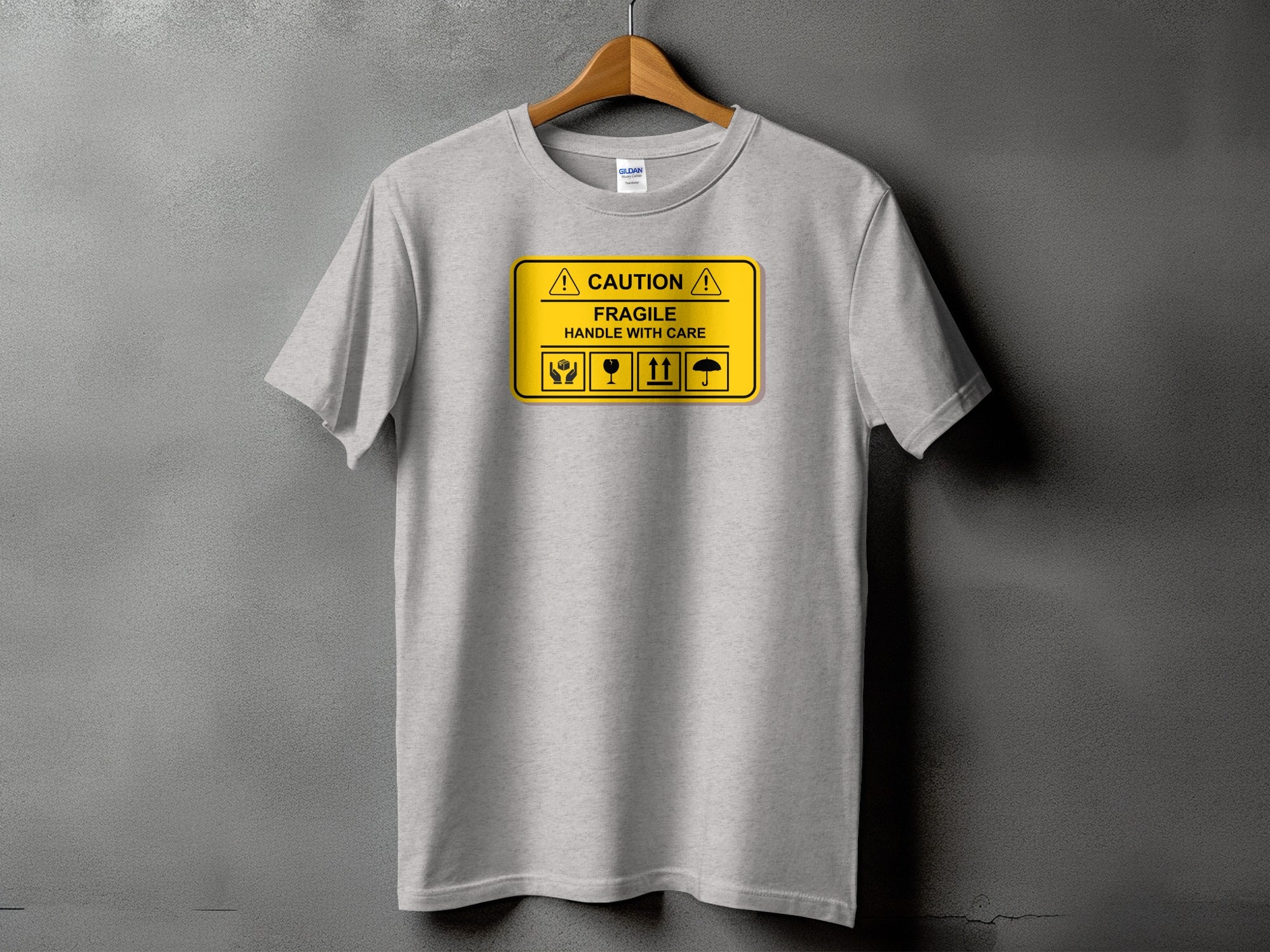 Gray t-shirt with "CAUTION FRAGILE HANDLE WITH CARE" and shipping symbols.