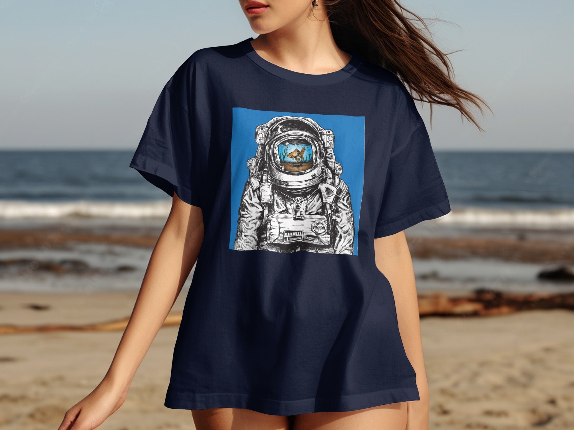Astronaut helmet reflecting a goldfish in a bowl design on a navy t-shirt.