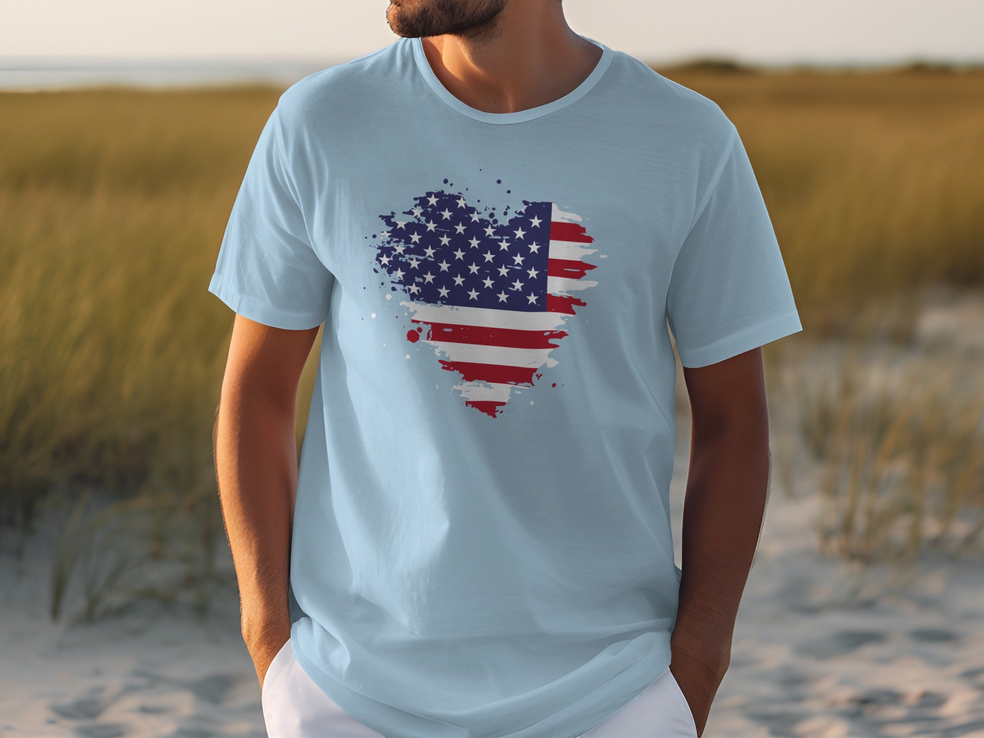 Light blue t-shirt with abstract splatter American flag heart graphic.