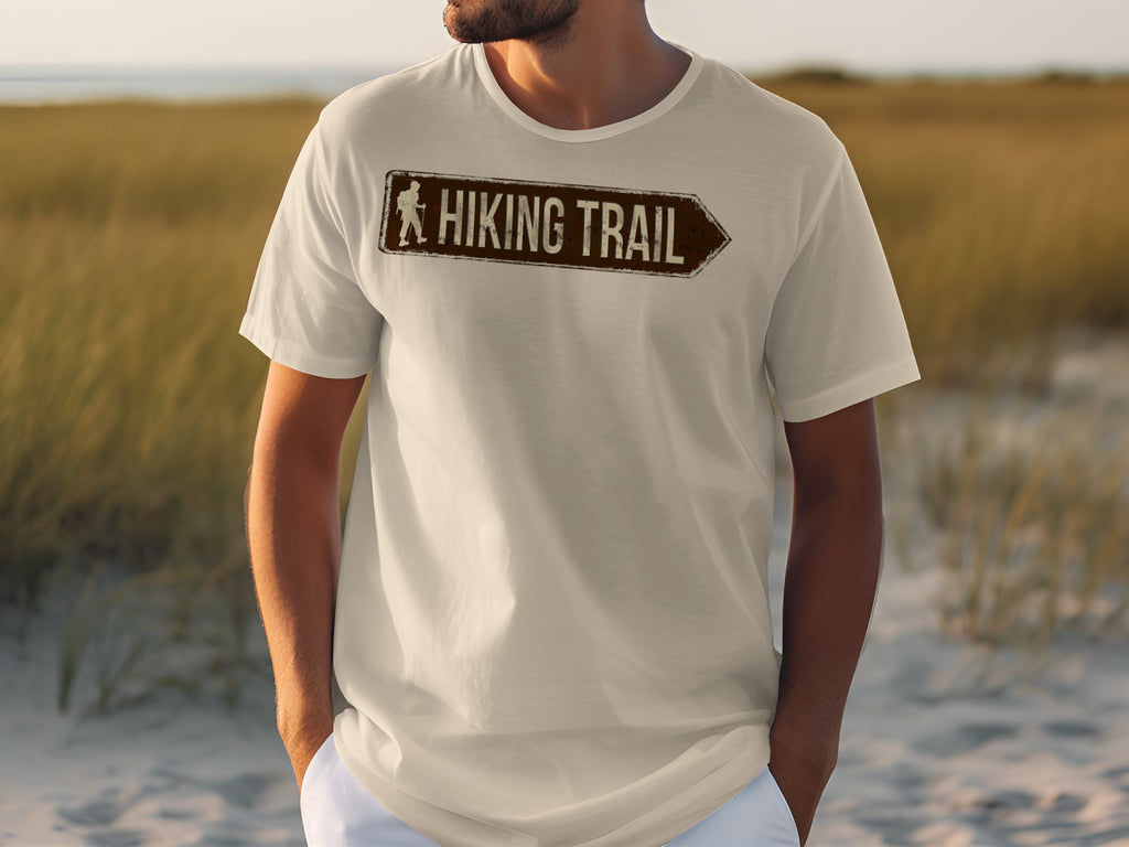 Cream t-shirt with distressed brown "Hiking Trail" sign featuring a hiker icon.